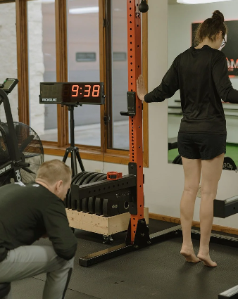 Patient working with a provider at a sports physical therapy clinic in Rhinelander, WI