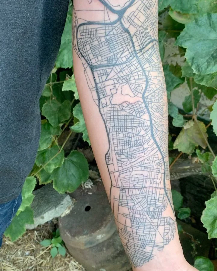 Map of Oakland with accurate and precise details. We built this piece over six months. 

Most everything pictured is healed. We had our last session filling black ink into a few of the large arterial freeways. 

I really enjoyed the meticulous detail