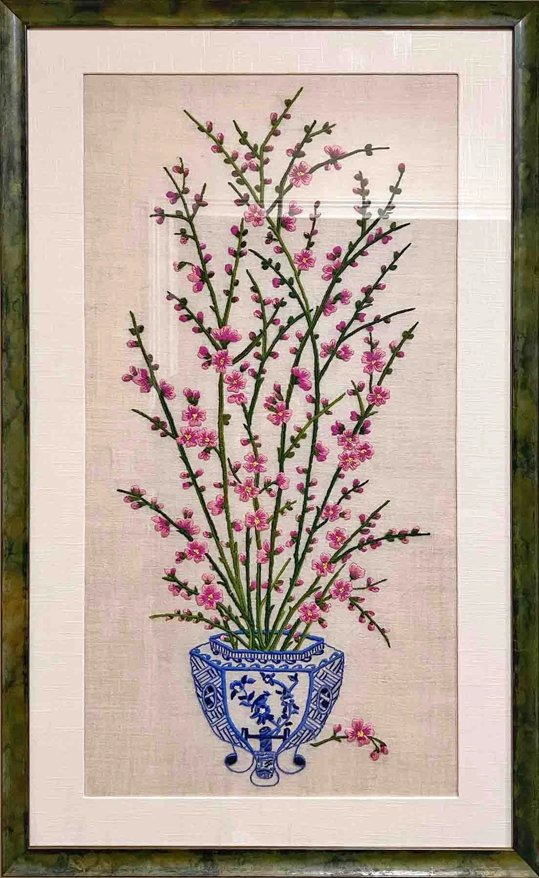 Embroidery, bordered with hand wrapped cotton matting and hand finished green patina over gold leaf frame.