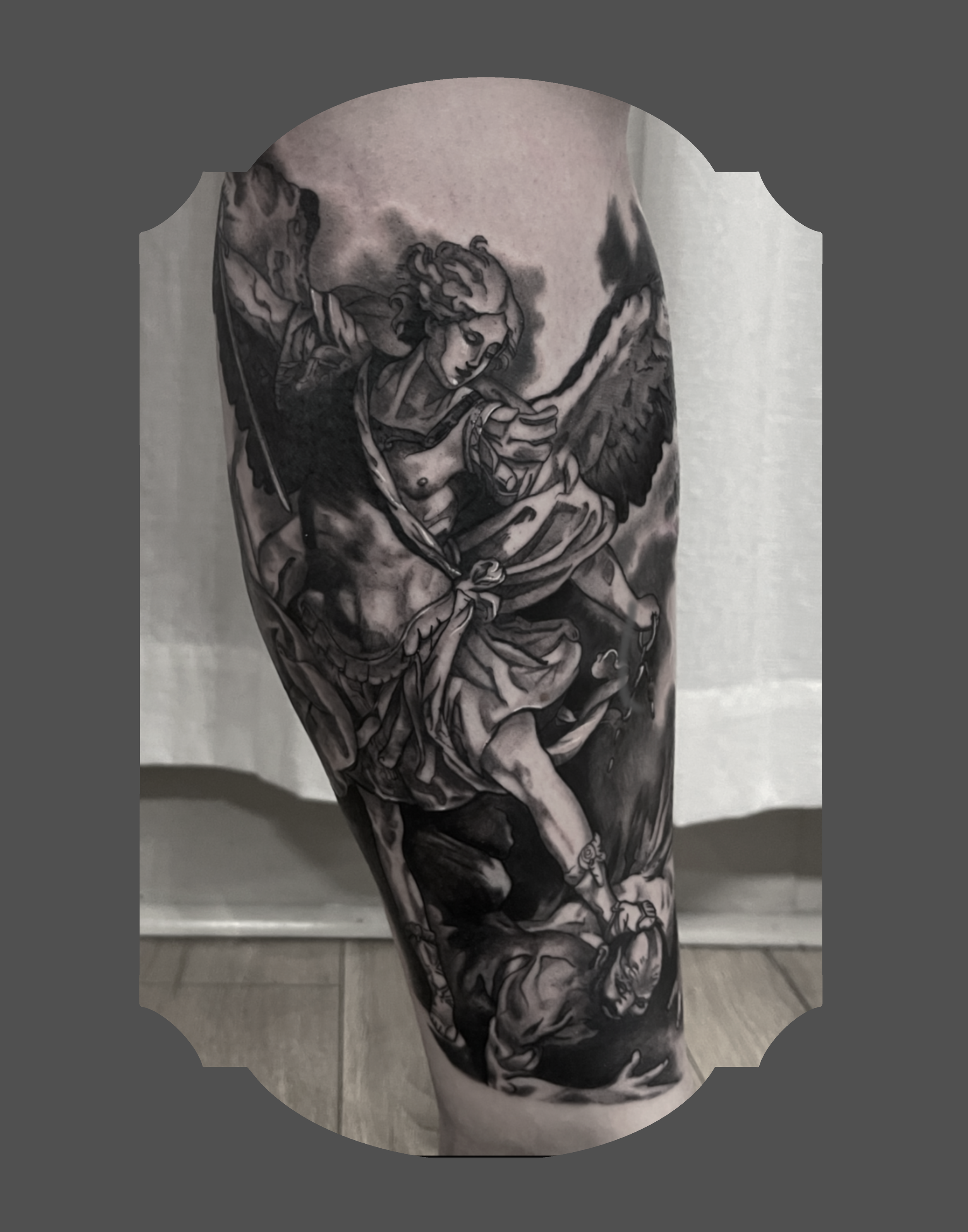 Black and gray tattoo of a angel's face with long flowing hair, holding a sword with both hands, on person's arm.