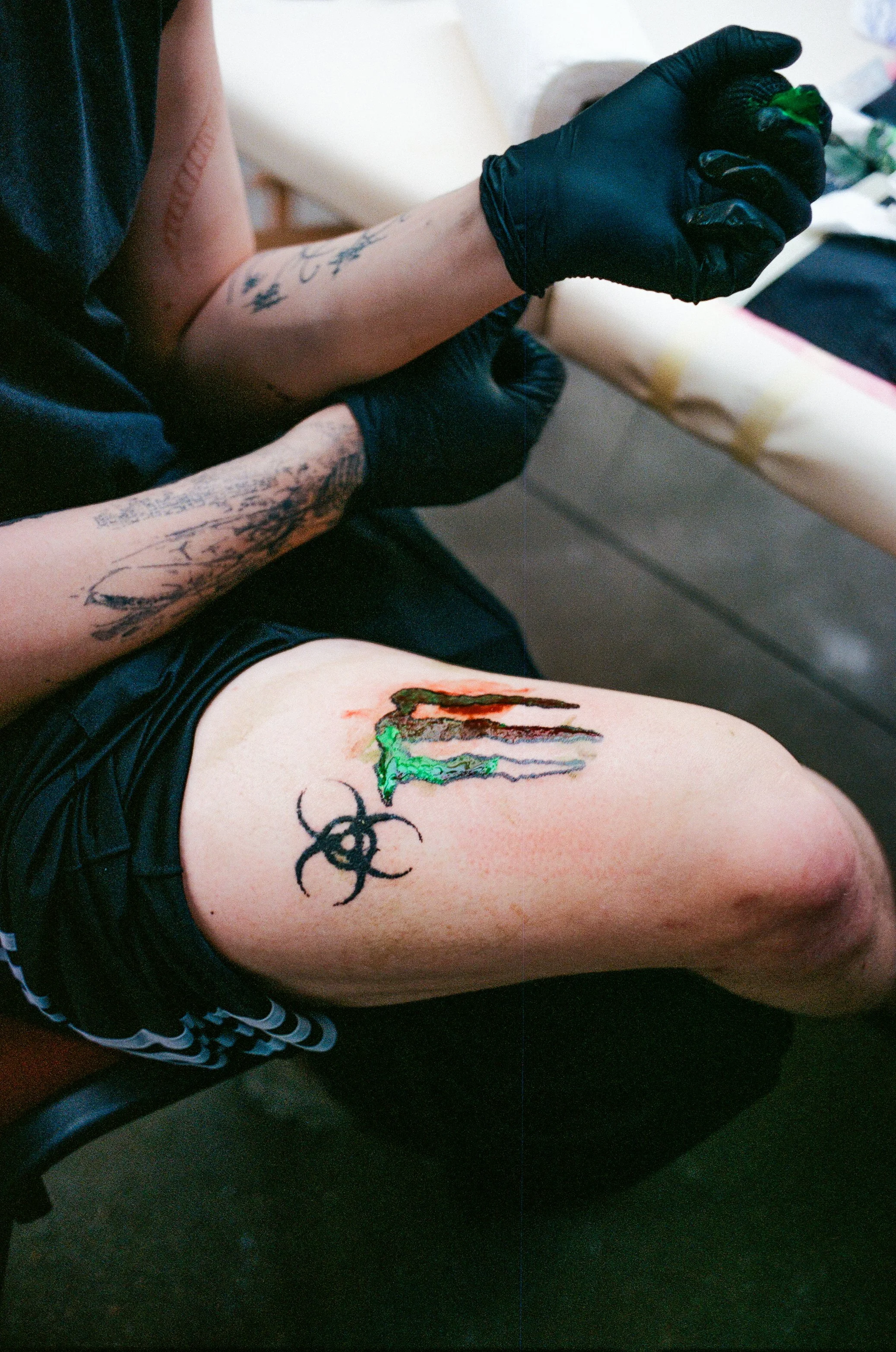 Tattoo artist working on himself. Lviv.