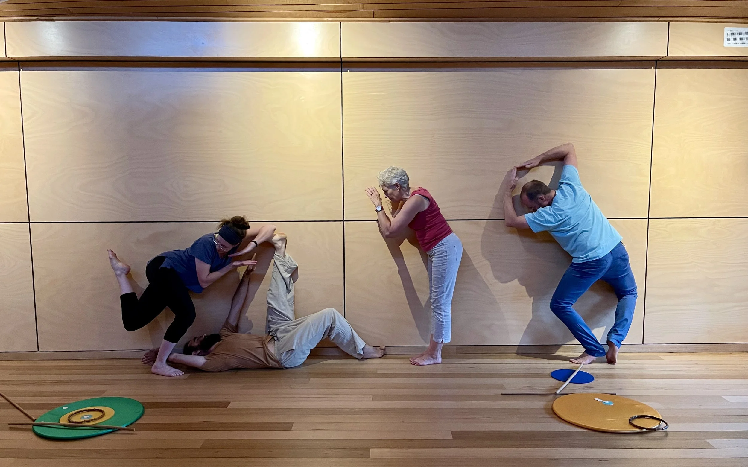 Creative dancers reflecting the inspiration of a Kandinsky artwork through spontaneous movement and stillness.