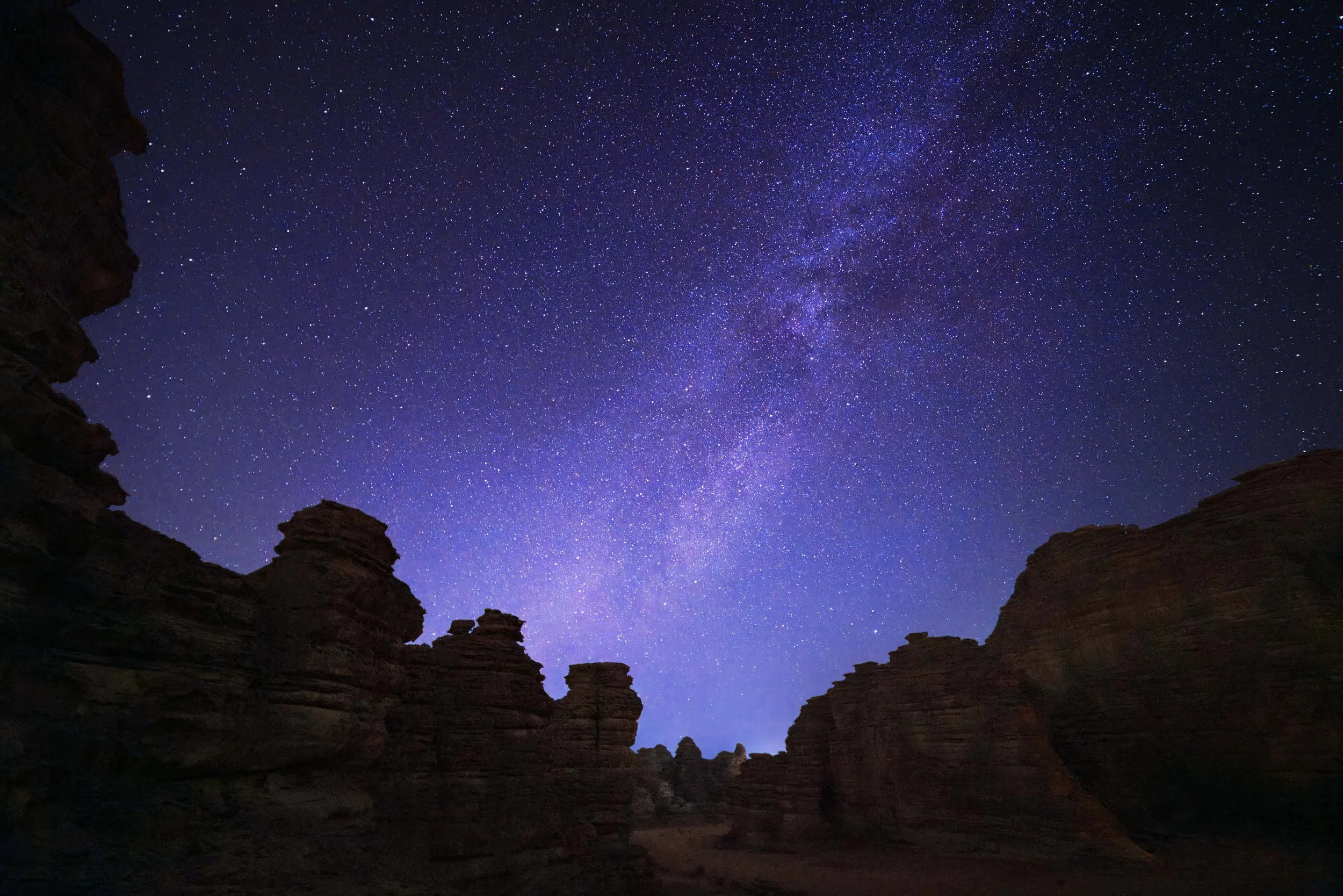 Milky way long exposure photography night sky in the desert in Bajdah Nature Reserve Neom Saudi Arabia