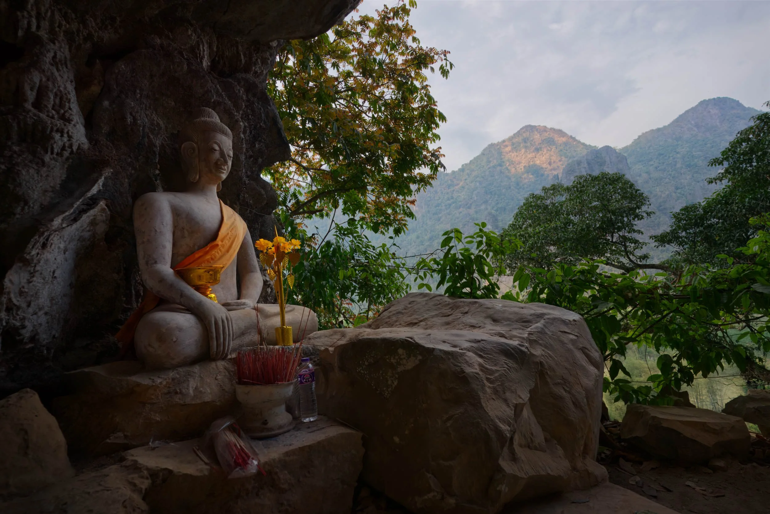 Buddha statue in a cave in Phapoungkham Viewpoint path Vang Vieng Laos