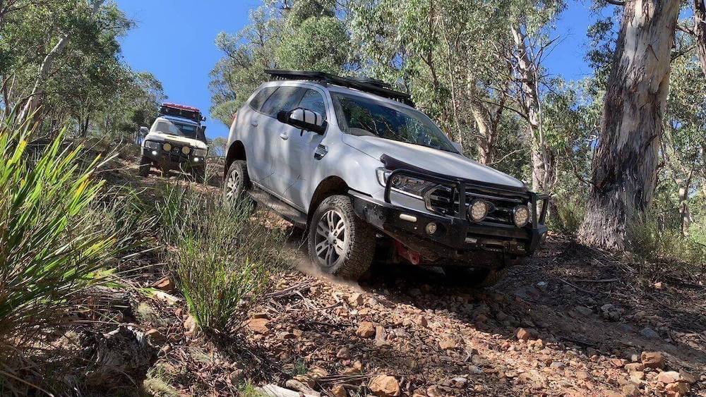 Two 4WD vehicles on steep track in Abercrombie River National Park