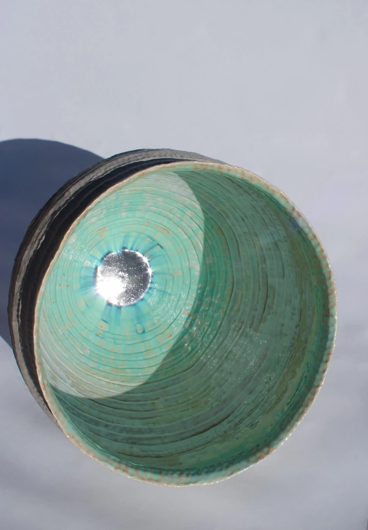 Interior view of the reclined Primordial Vessel: a giant ceramic vessel sculpted out of ivory stoneware clay and containing crystalline glaze by multidisciplinary artist Noemie Marmara