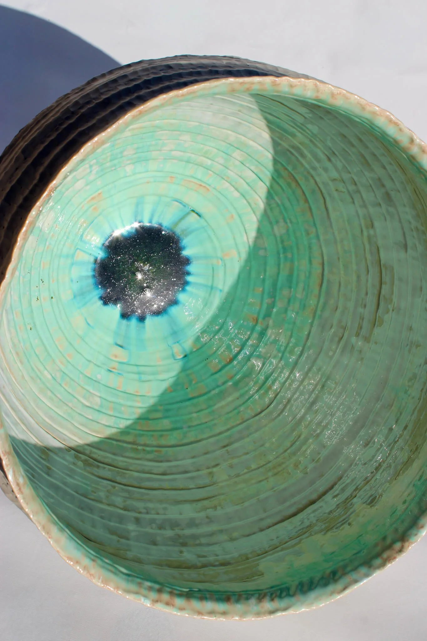 Interior view of the reclined Primordial Vessel: a giant ceramic vessel sculpted out of ivory stoneware clay and containing crystalline glaze by multidisciplinary artist Noemie Marmara