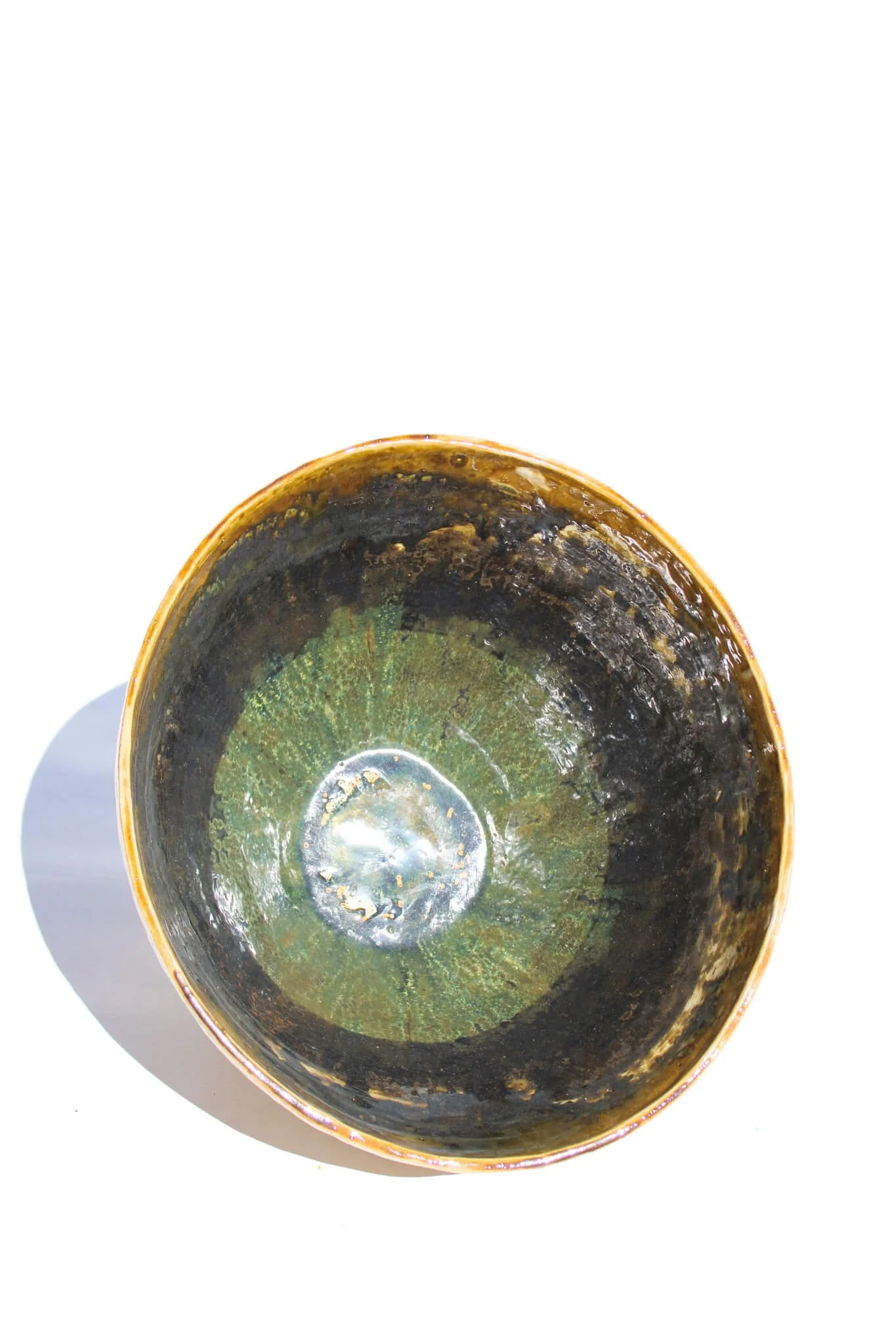 Interior view of the IRIDESCENT VESSEL from the Diamond Being Collection of contemporary ceramic works created by Noémie Marmara. An open vessel created from porcelain and stoneware fireclay, containing crystalline glazes, copper and gold.