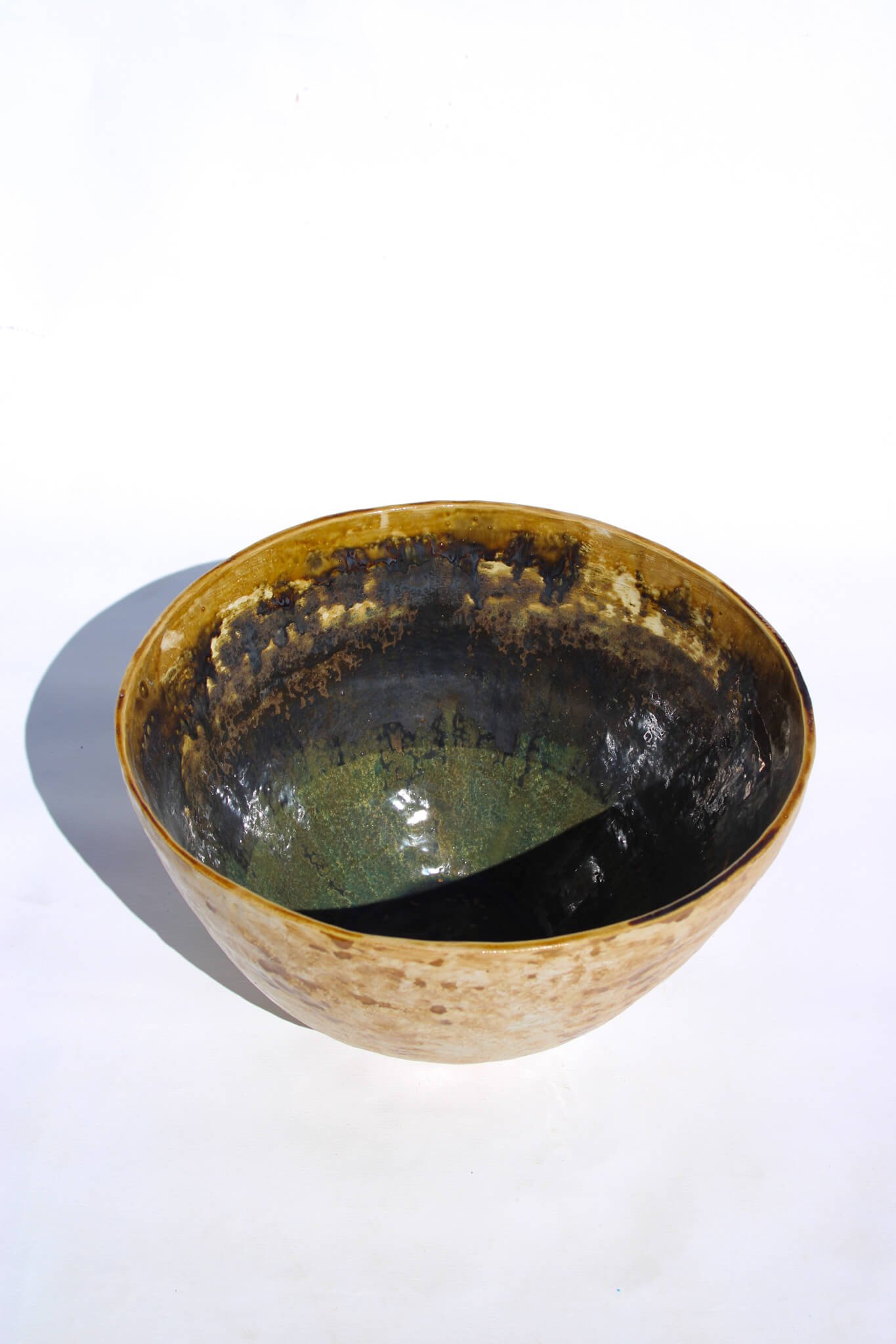 Full view of the IRIDESCENT VESSEL from the Diamond Being Collection of contemporary ceramic works created by Noémie Marmara. An open vessel created from porcelain and stoneware fireclay, containing crystalline glazes, copper and gold.
