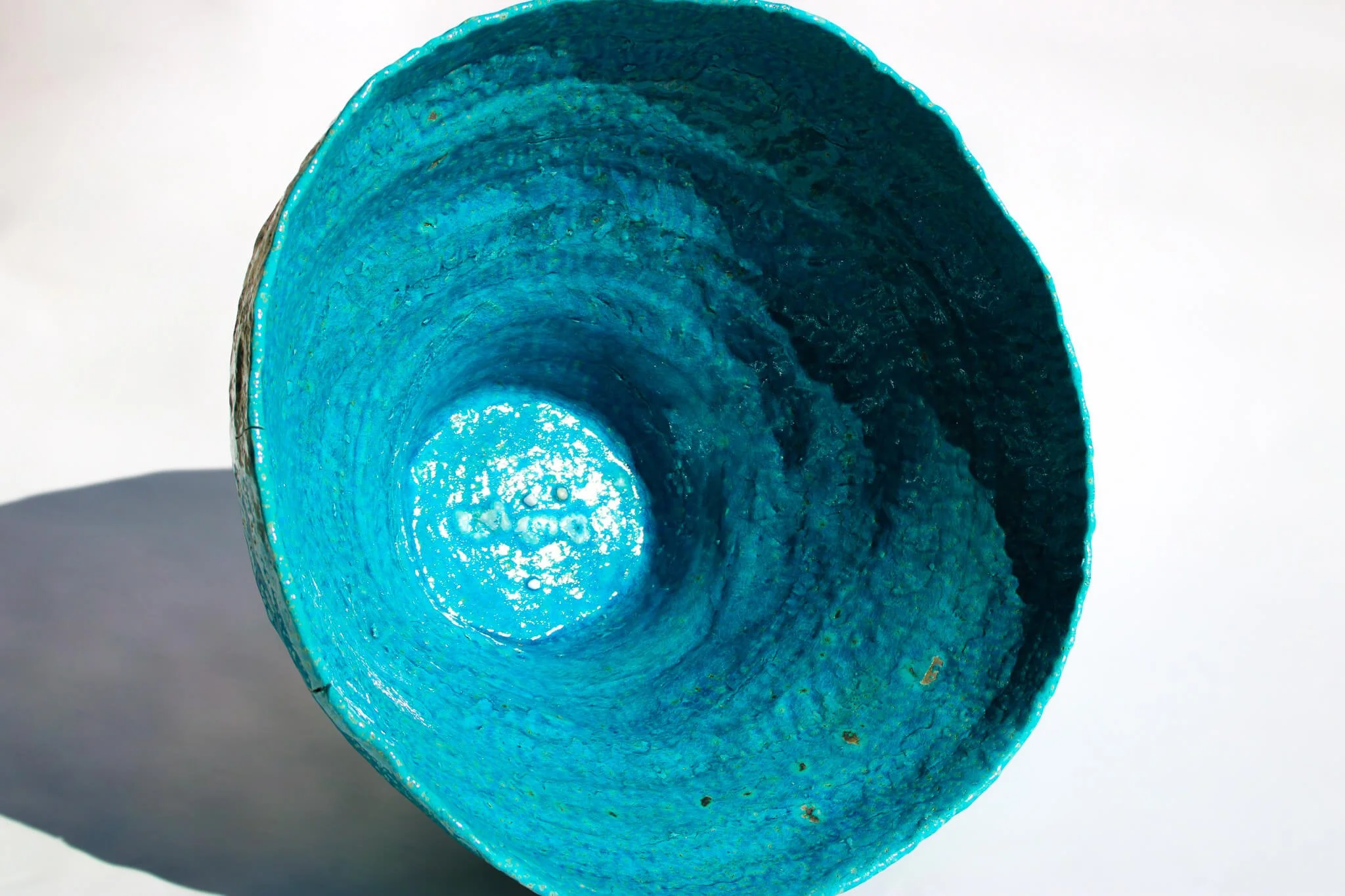 The ATLANTIS Giant Vessel, sculpted from Egyptian Clay and containing turquoise blues, sand and glass. Created by multidisciplinary artist Noémie Marmara, founder of intimate immensity® artistic works.