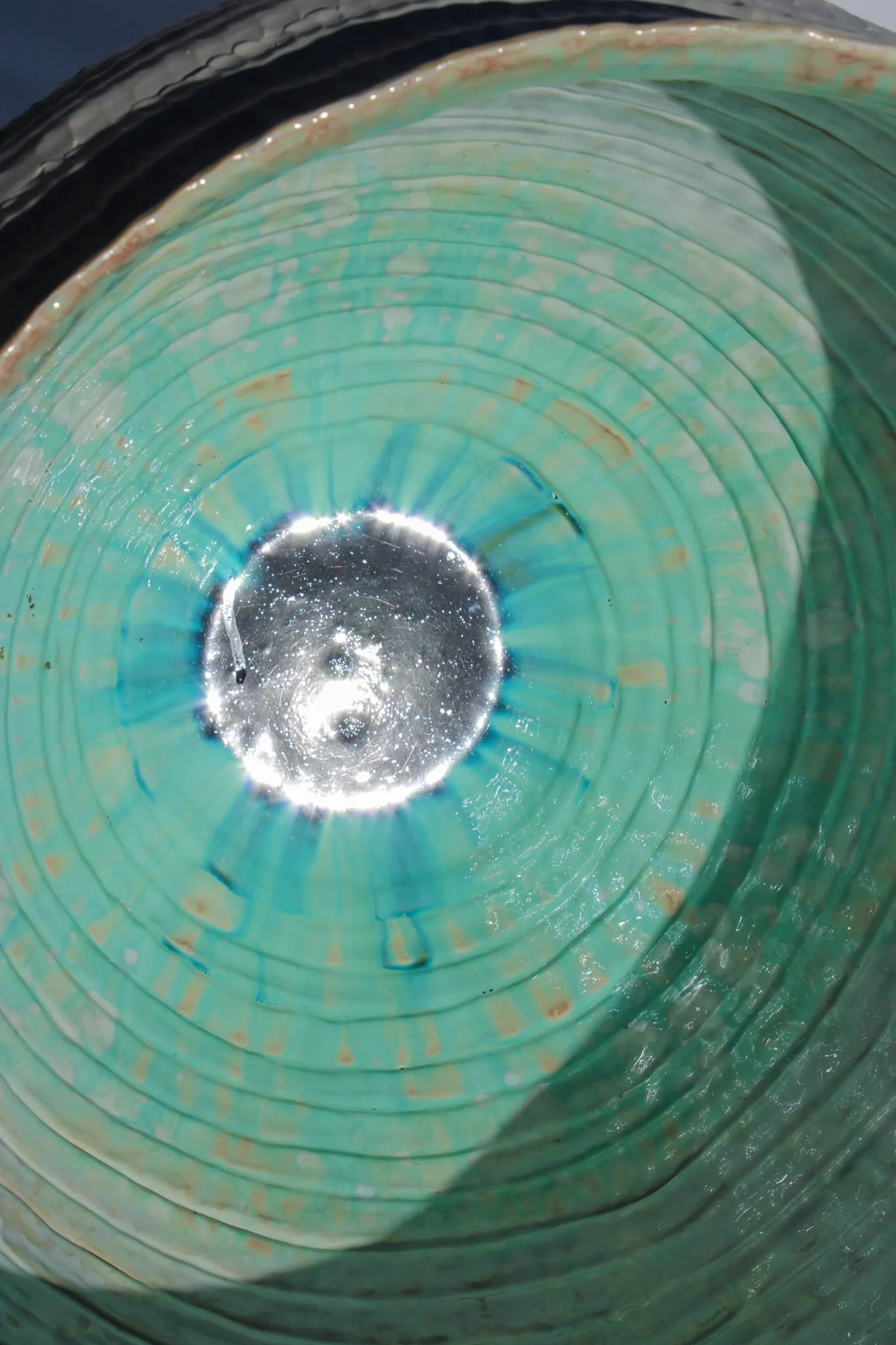 Interior view of the reclined Primordial Vessel: a giant ceramic vessel sculpted out of ivory stoneware clay and containing crystalline glaze by multidisciplinary artist Noemie Marmara