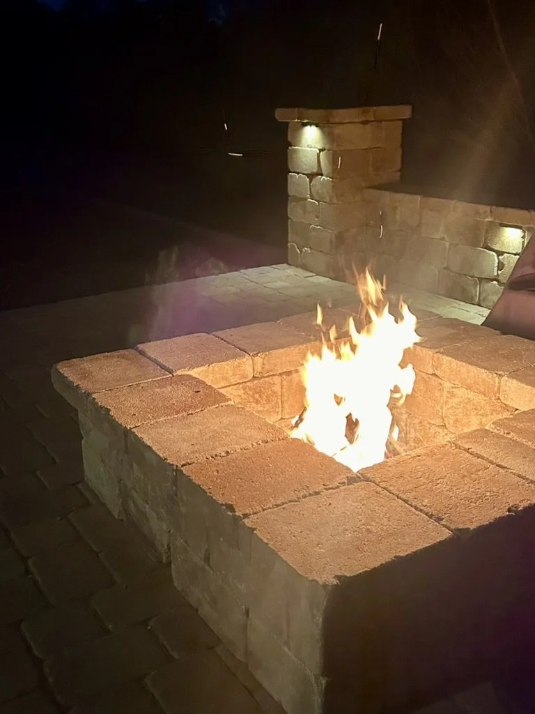 Warm and inviting fire pit area with ambient lighting for nights.