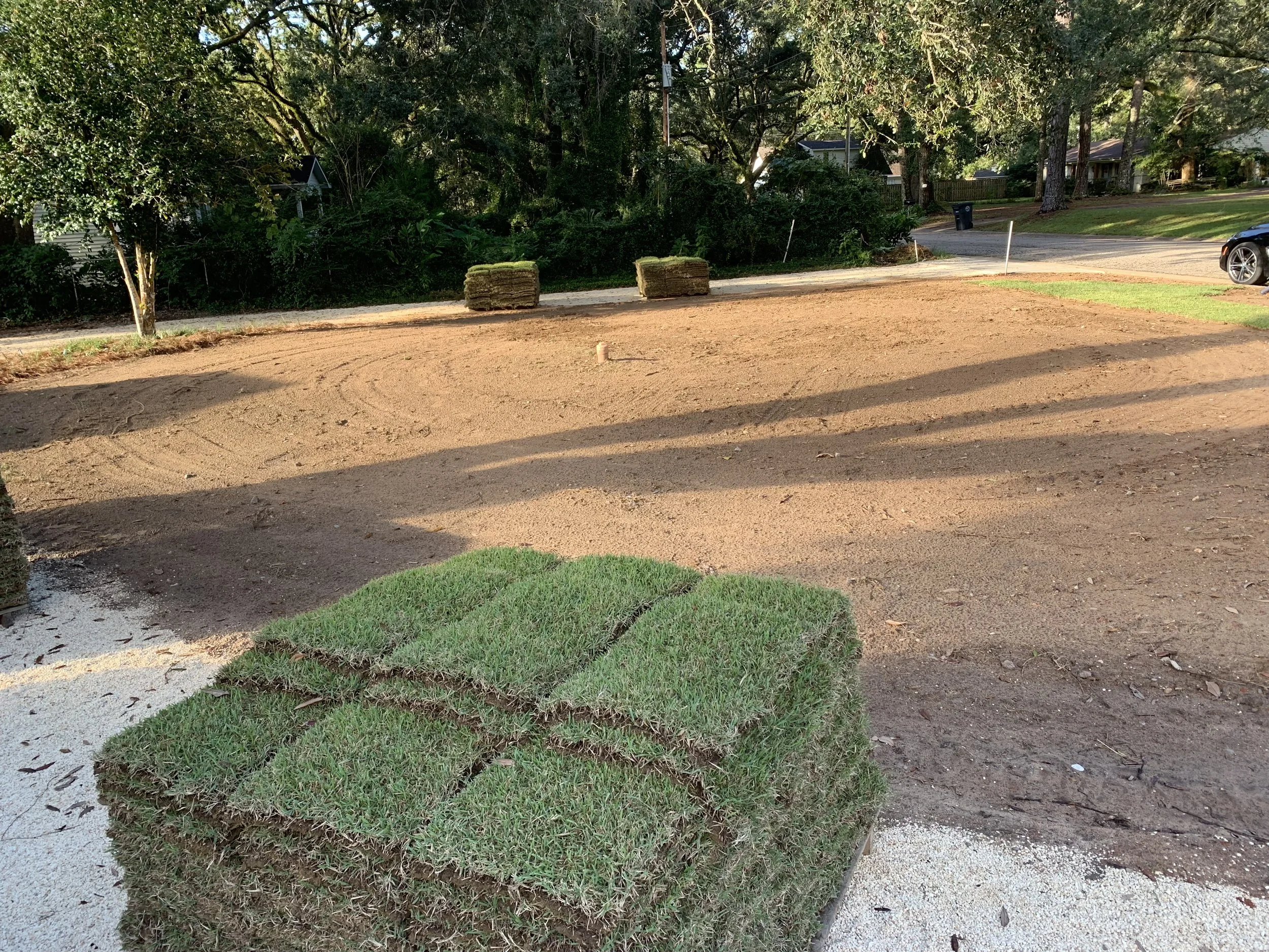 Sod preparation for new lawn installation in a residential area