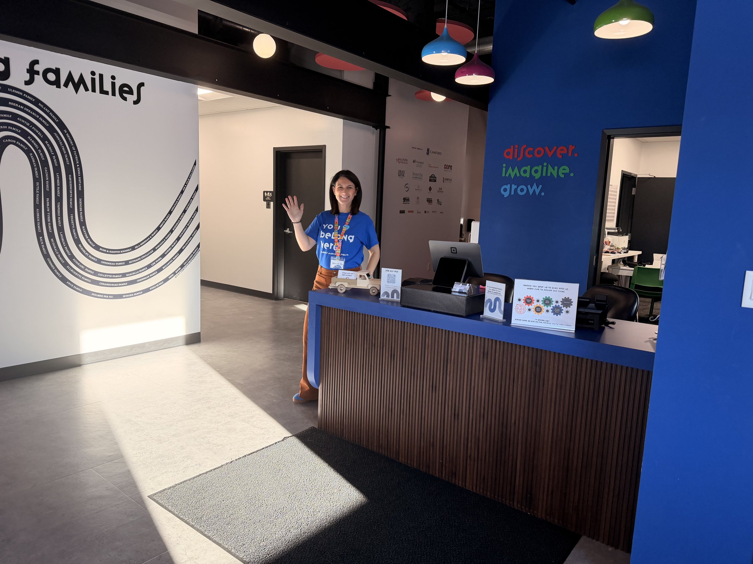 Check in desk and waving staff-person