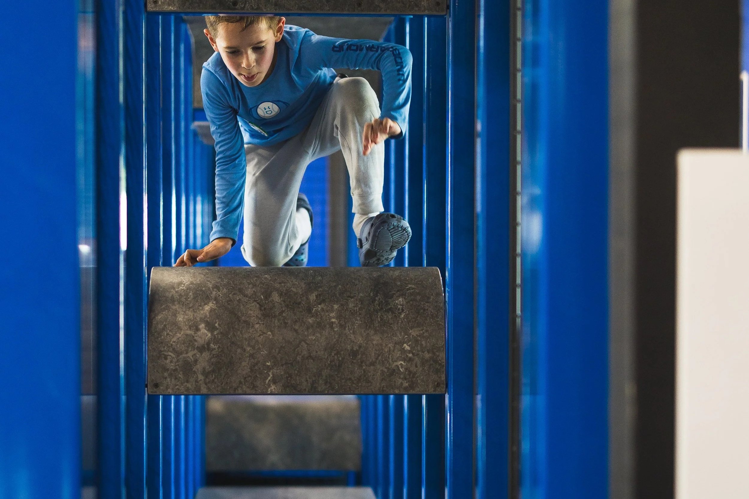 Child in climbing structure at the museum