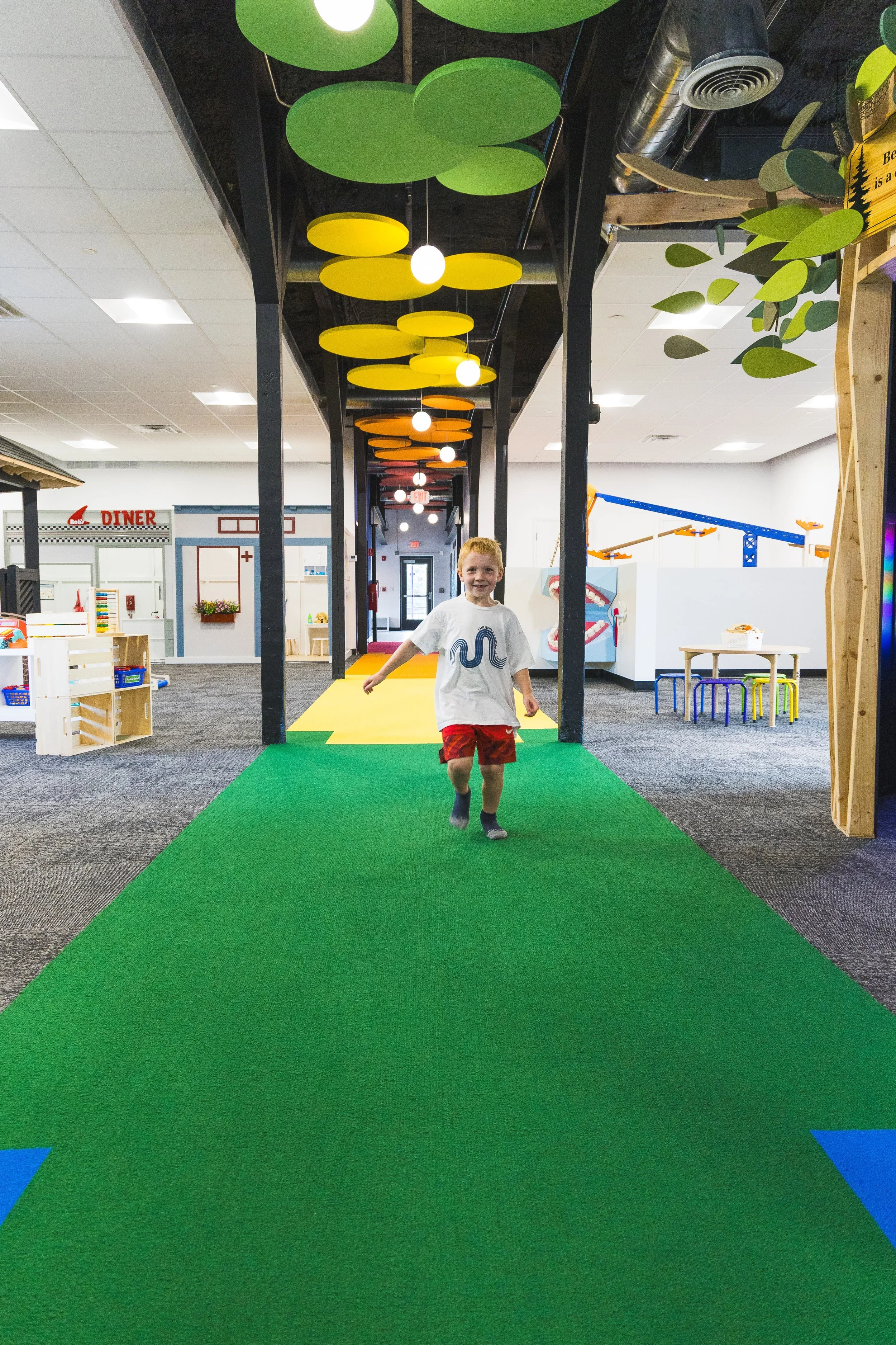 child in the exhibit space of the museum