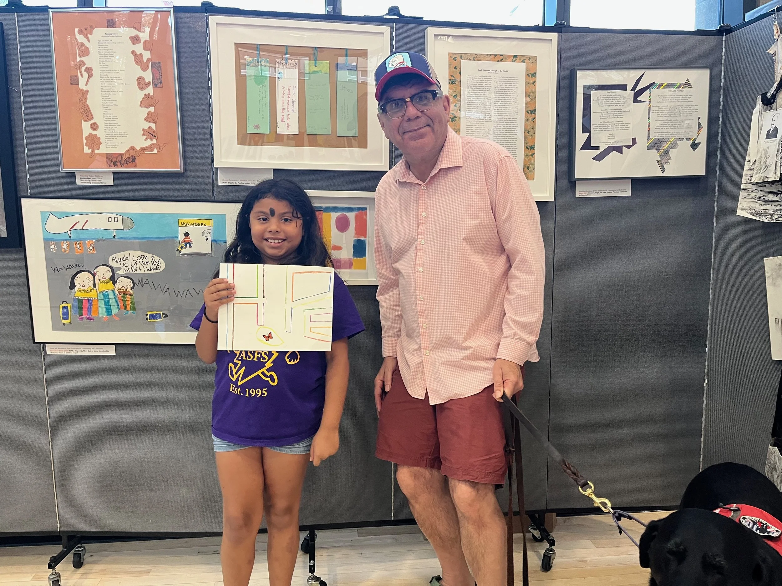 A child sharing her version of the Hope artwork with the artist, Victor