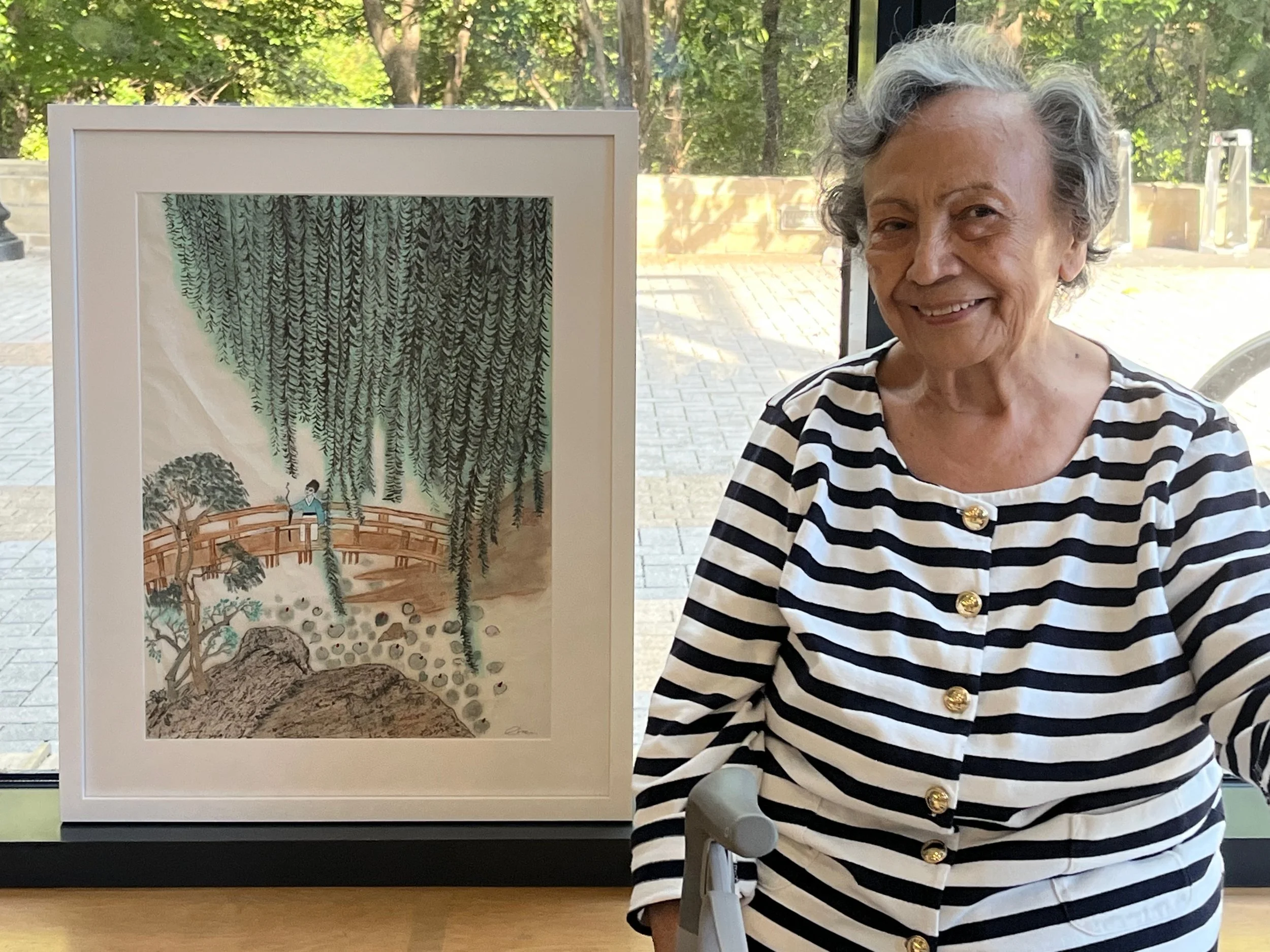 Rosa Calzadilla visits early and sees her artwork framed for the exhibit