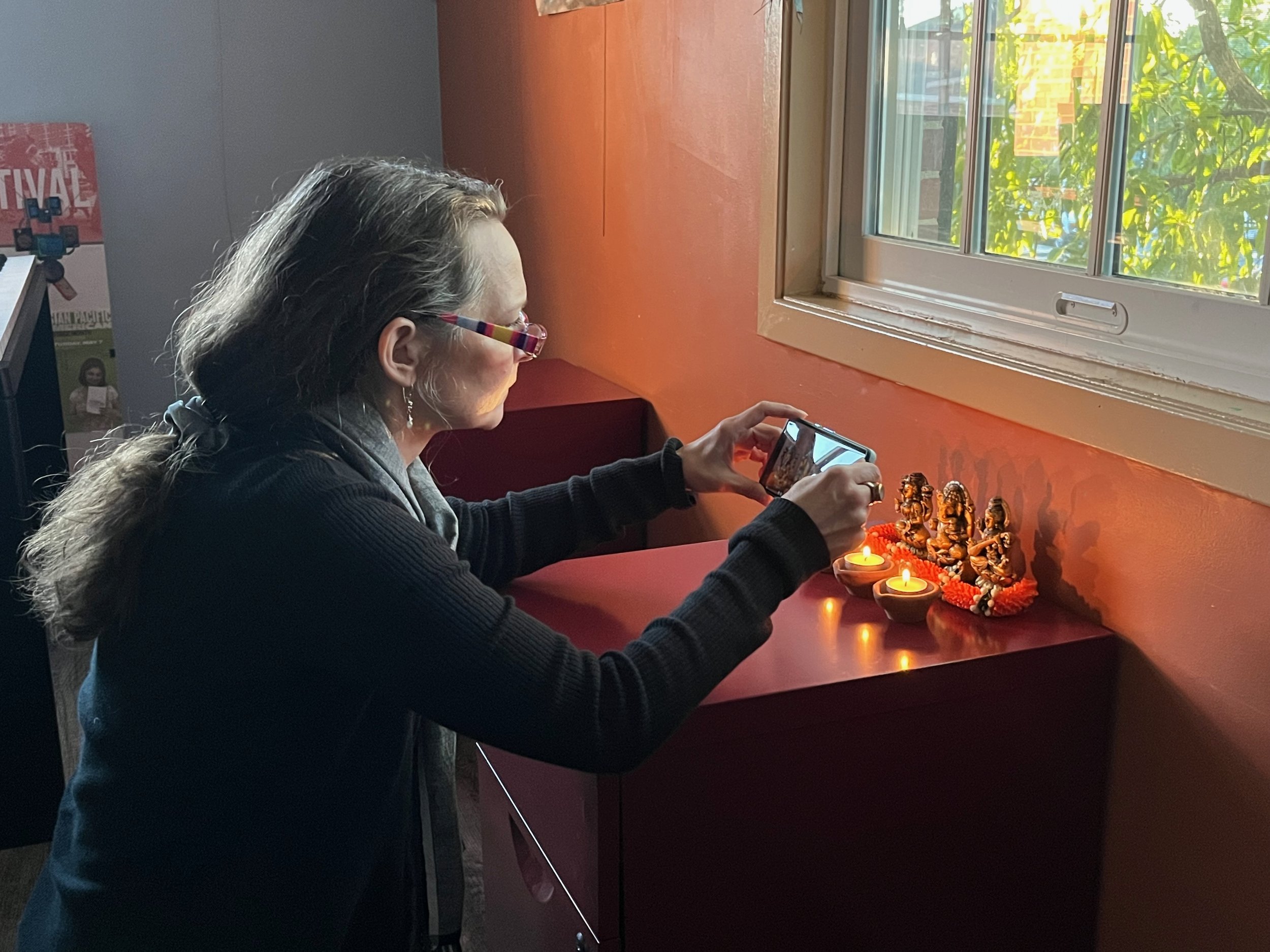 LouLou Marino took many of the photos of objects that tell the stories of Diwali. She is working on a video about the project as well. Having lived in Asia, she remembered how many incense sticks she had seen when she visited temples there. So I incl