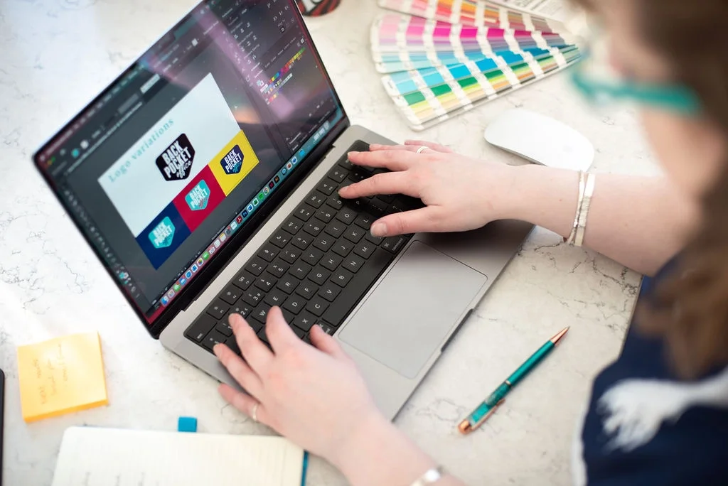 Graphic Designer Just Sian working on a brand identity project