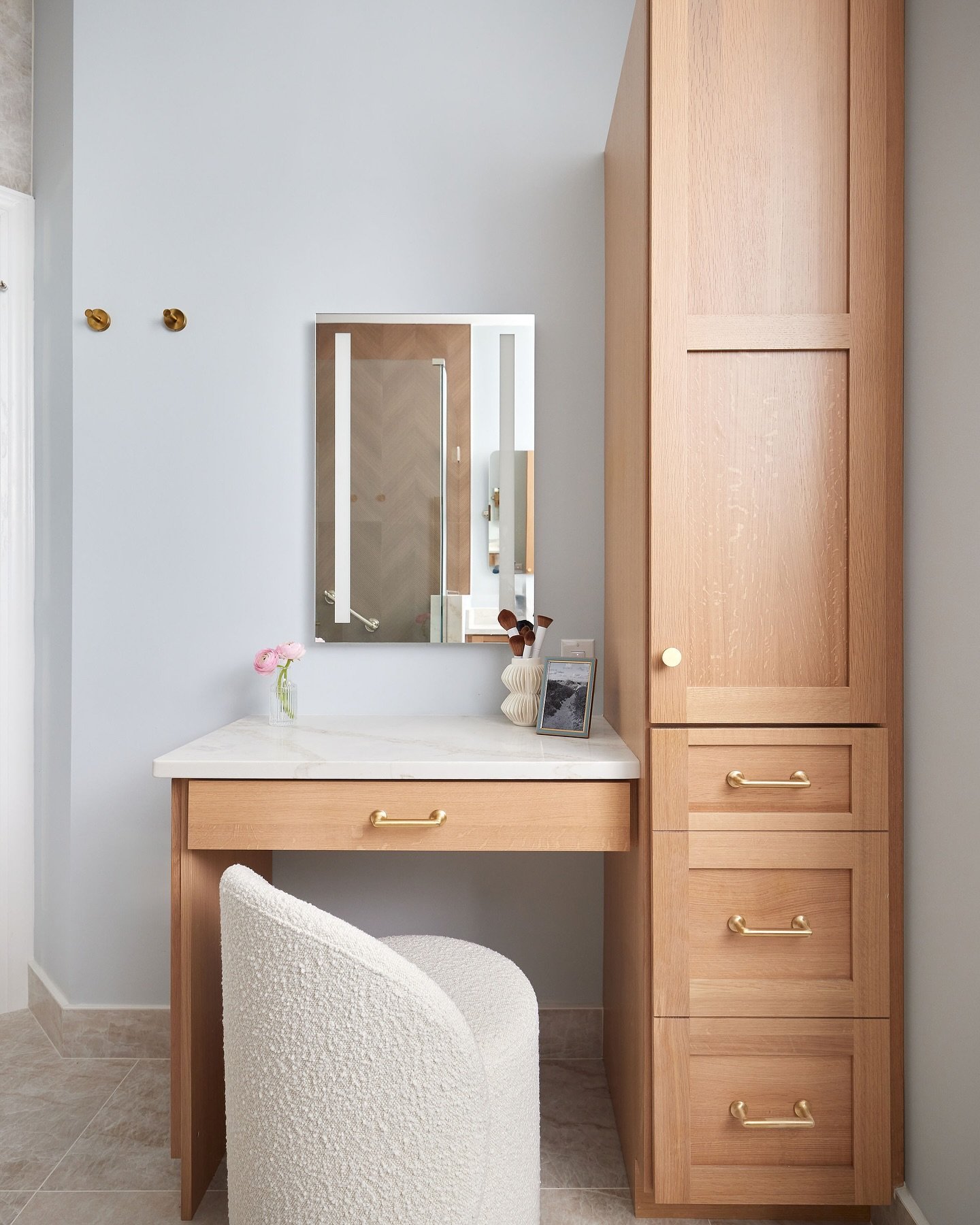 What better place is there to get ready each morning? The bottom cabinet actually pulls out and is a hot tools drawer. Everything you need right there including being plugged in. Mirror is lit for extra light applying makeup. And we chose a swivel st