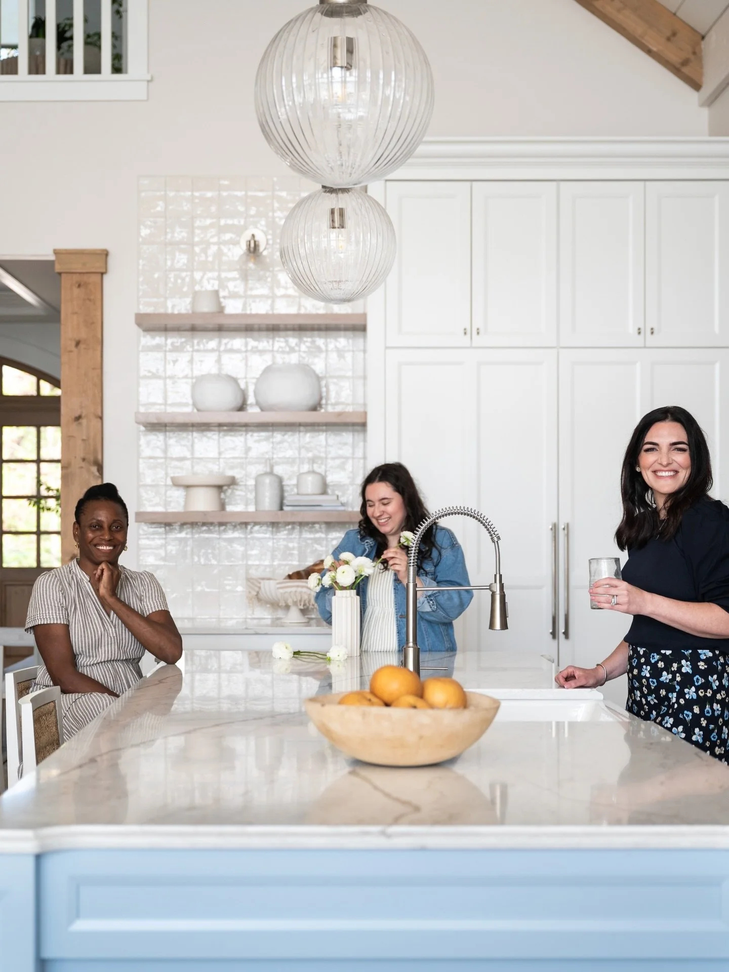 A little throwback to last summer and a happy moment captured just as our clients were about to move in to their new home.

Install days and the final reveal are favorites of ours. (The smiles are real!) Here, the design team for this new home (Yvett