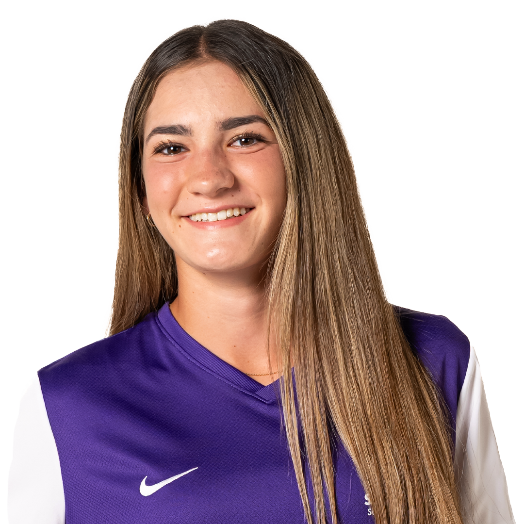 Portrait of a young woman wearing a purple sports jersey with a white Nike logo, smiling with long straight hair.