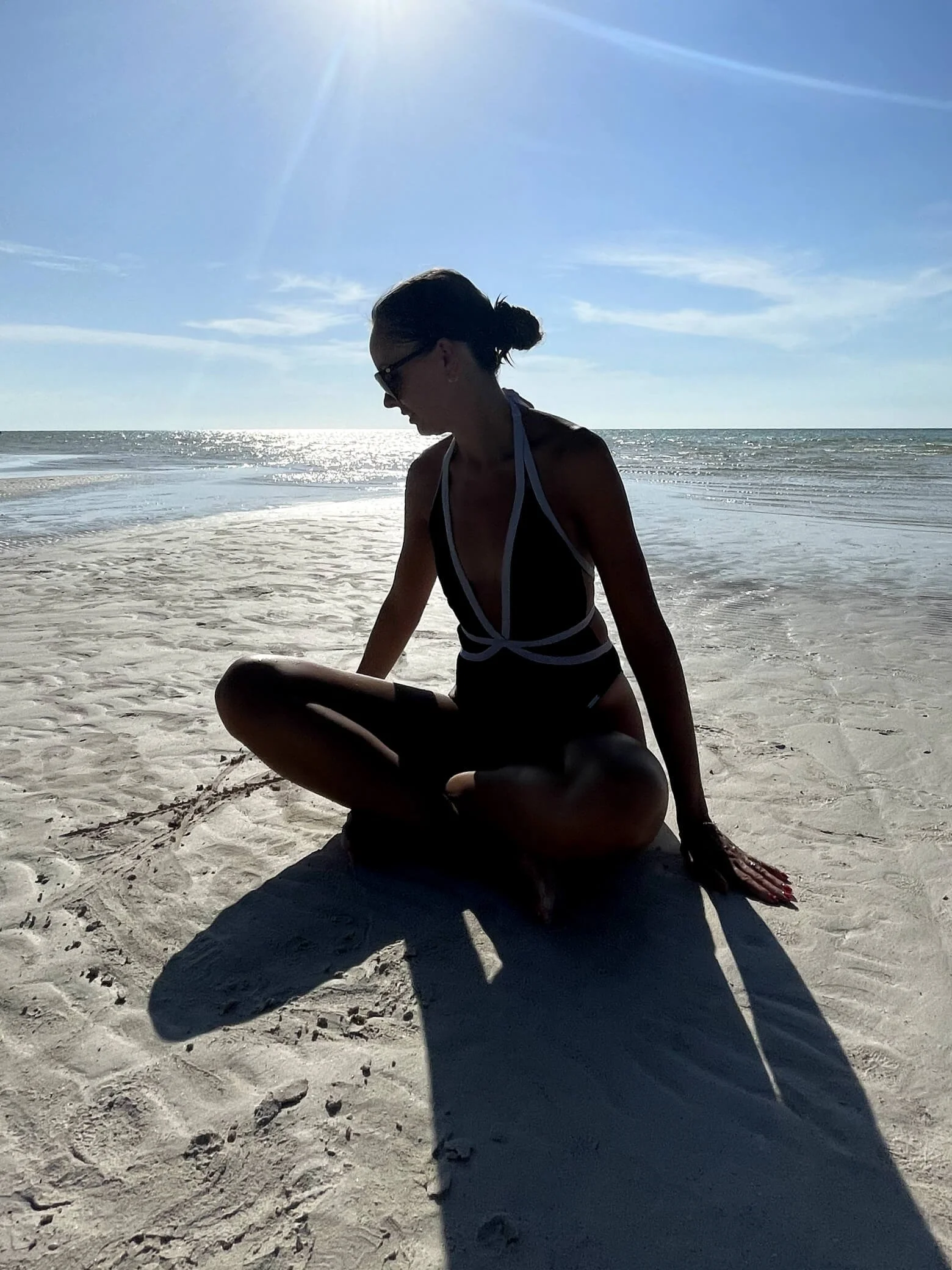Sarah sitting on the beach