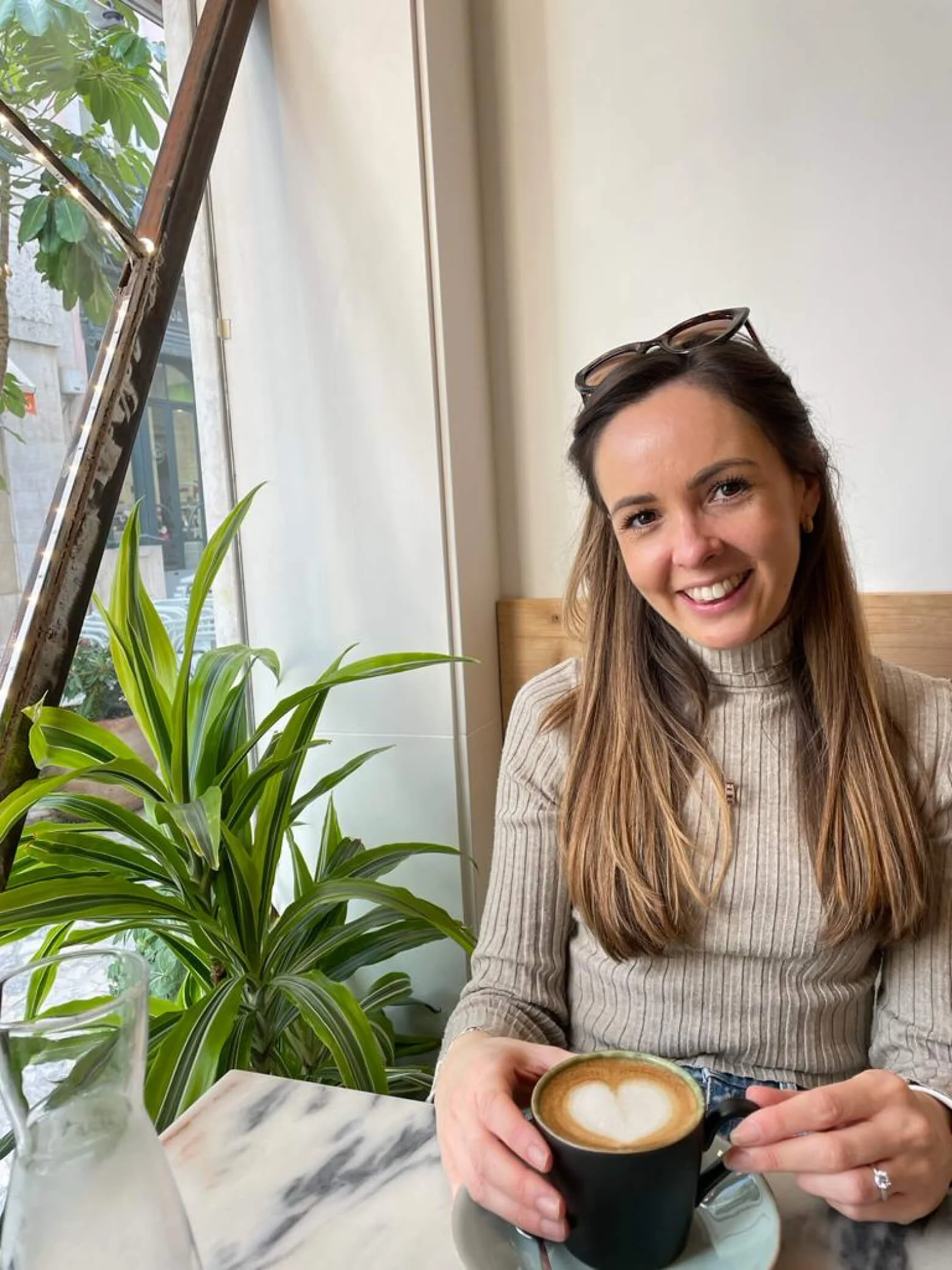 Sarah drinking a coffee