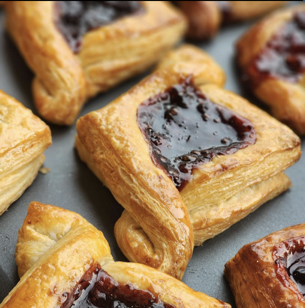 Instagram Feed | Dazie.patisserie | Caption reads "Come and try our wild berry Danish this morning!!! They are moving like hot cakes!!! #teamdadzie#pâtisserie#bloomfield#bakery #dessert#cakes"