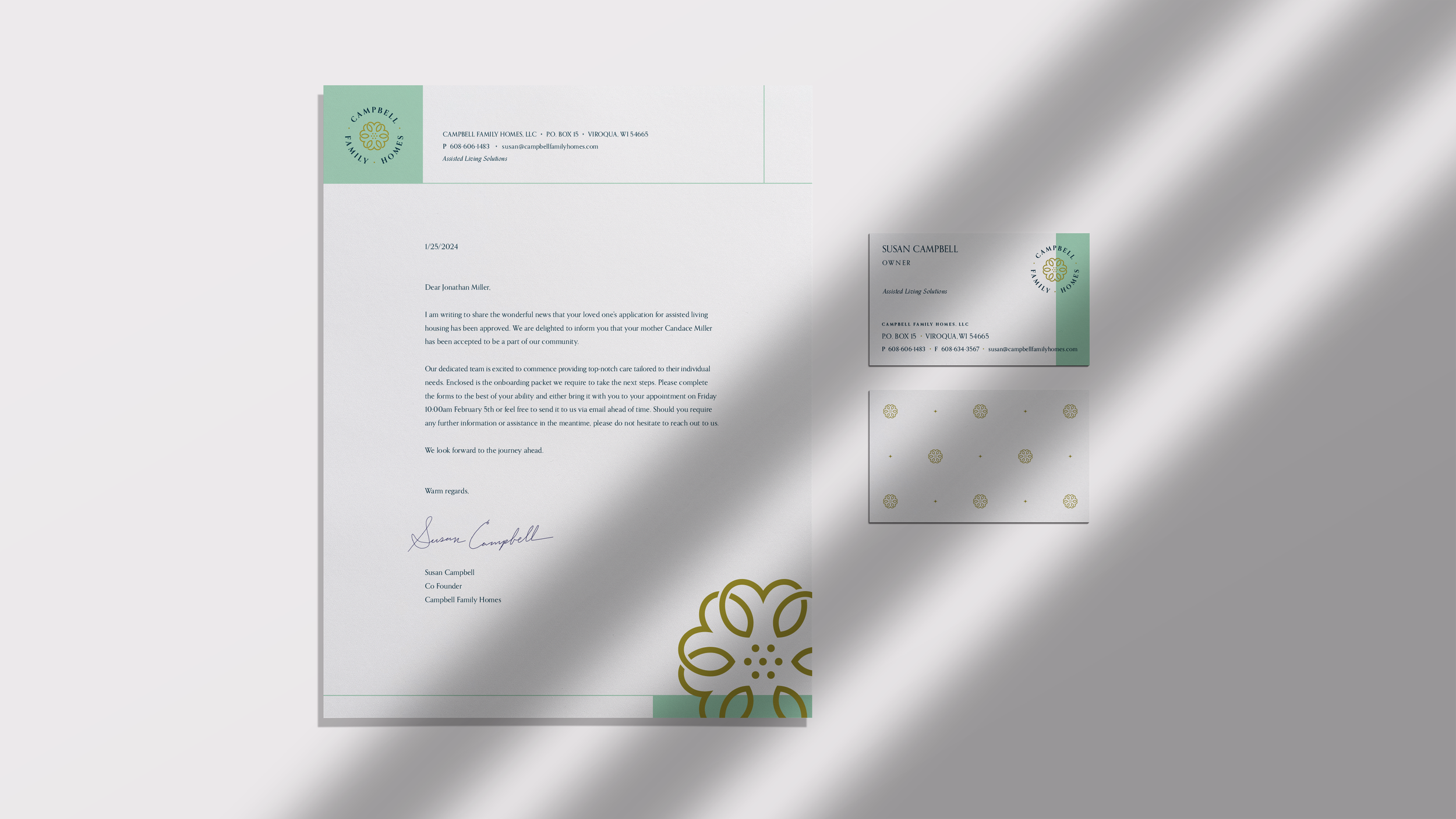Clean modern stationery set for Campbell Family Homes showing the letterhead and front‑and‑back business card designs.