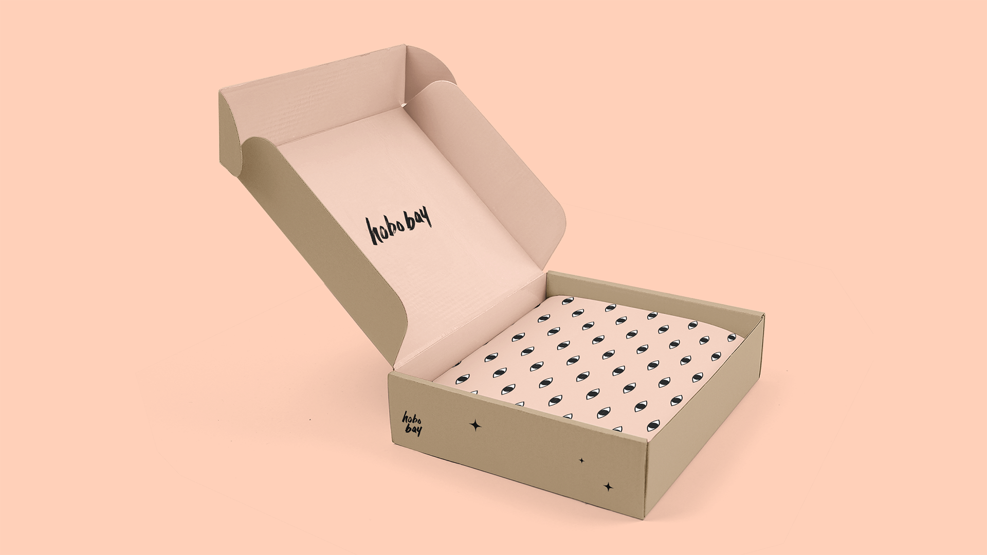 Hobo Bay Package Design with single color brand details on the box, hand lettered logo and custom tissue paper brand pattern