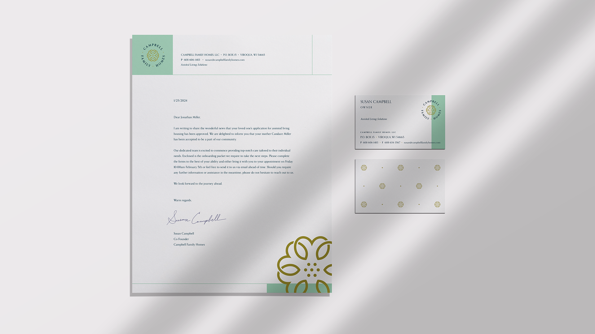 Clean modern stationery set for Campbell Family Homes showing the letterhead and front‑and‑back business card designs.