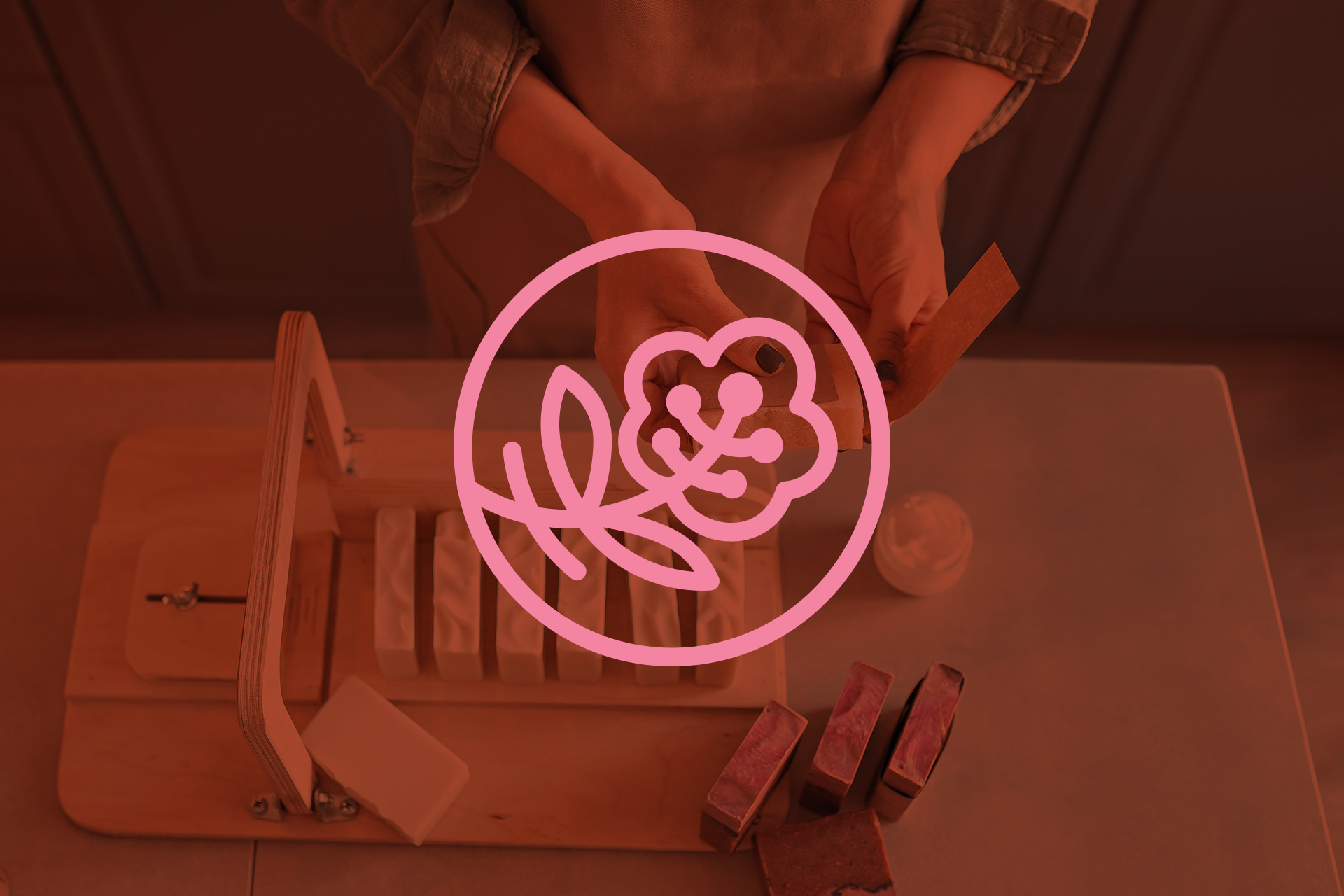 Brand identity photo treatment featuring a custom line‑art cherry blossom flower icon logo.