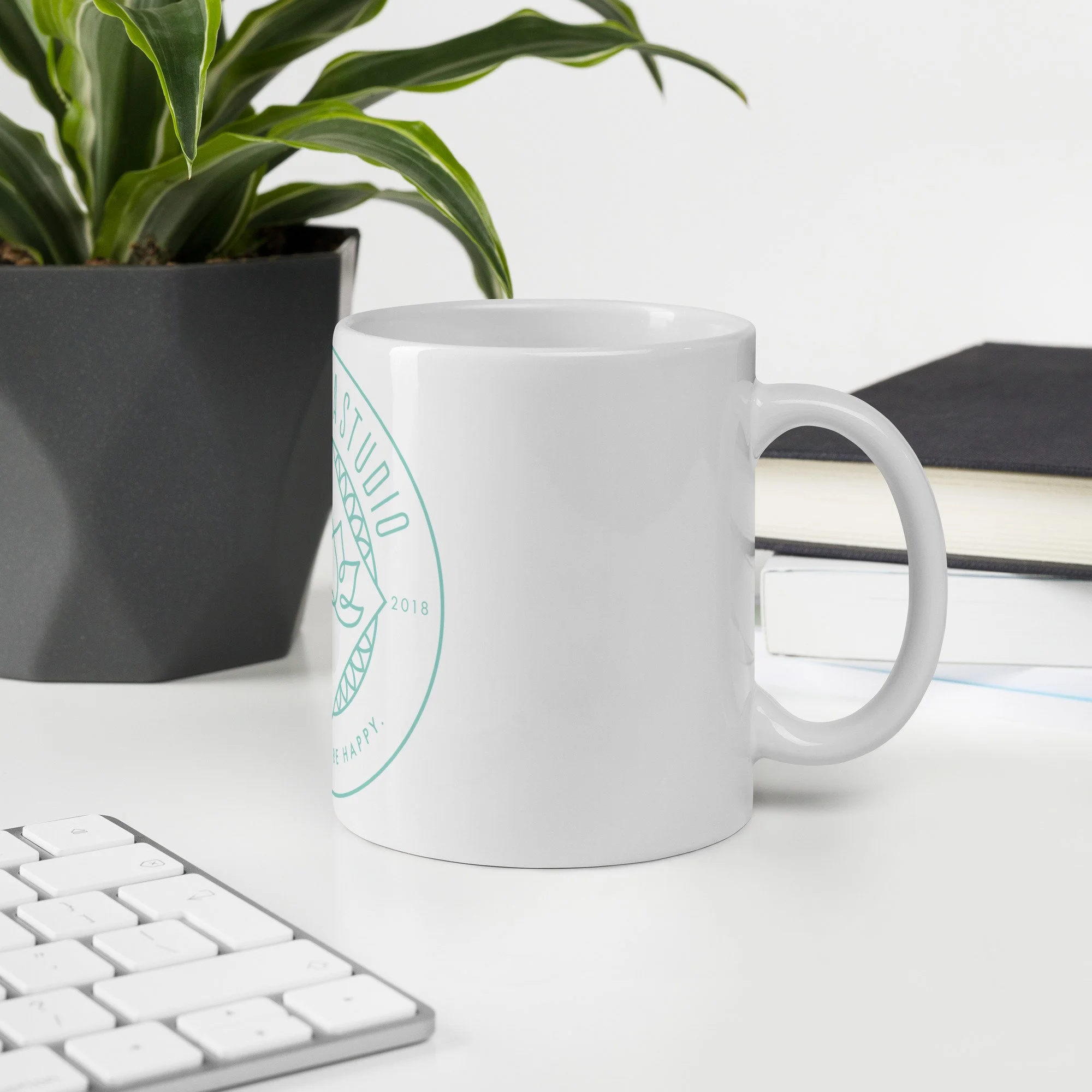 white-glossy-mug-white-11-oz-office-environment-6a4c33b51a4cd.jpg