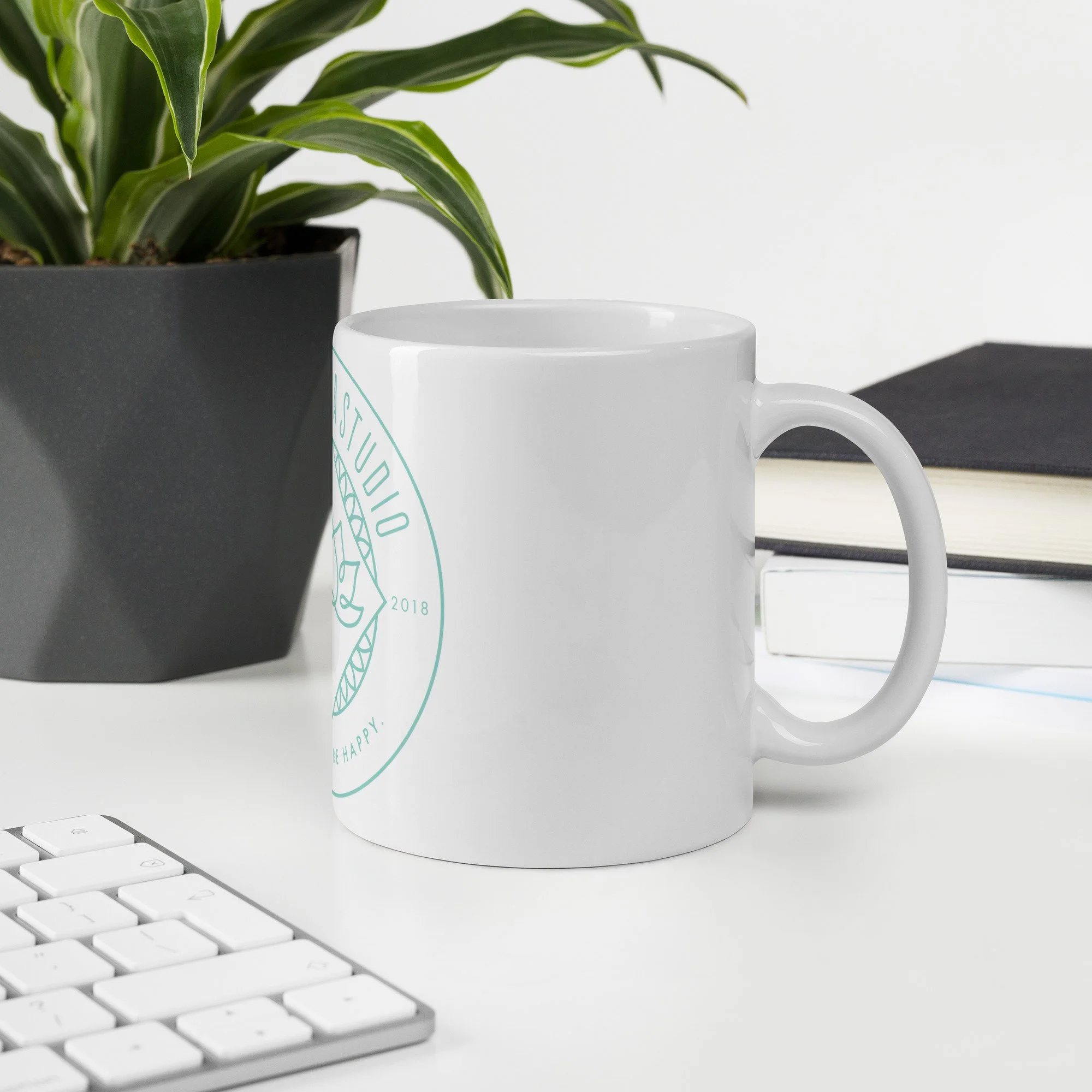white-glossy-mug-white-11-oz-office-environment-6a4d7ba79e803.jpg