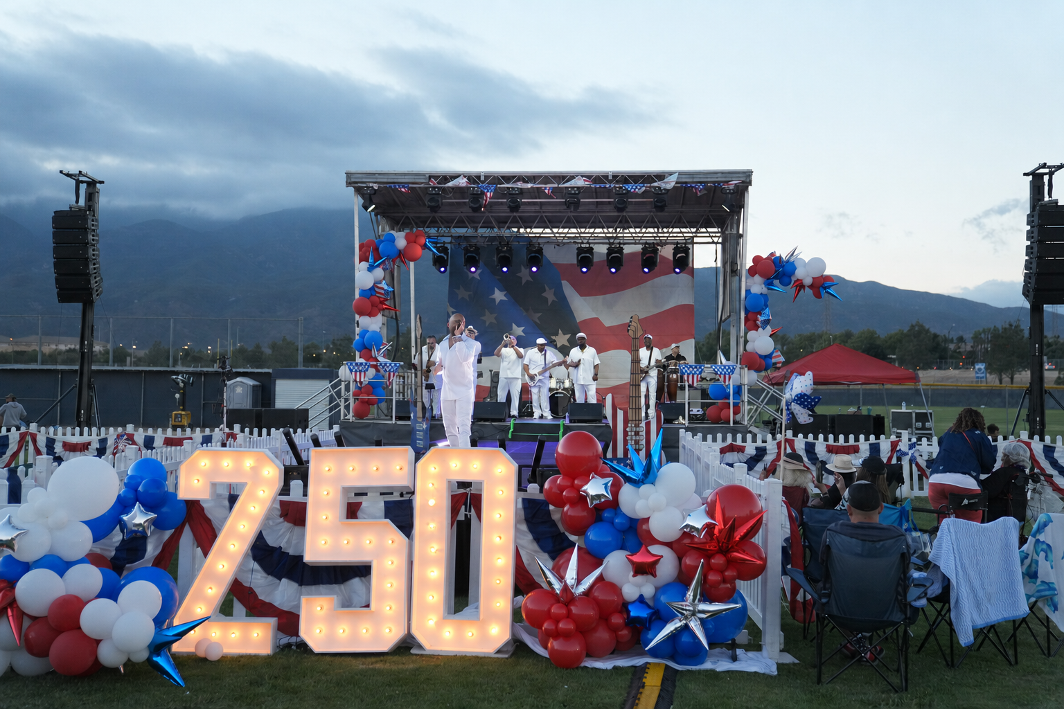 Patriotic concert celebration at dusk.png