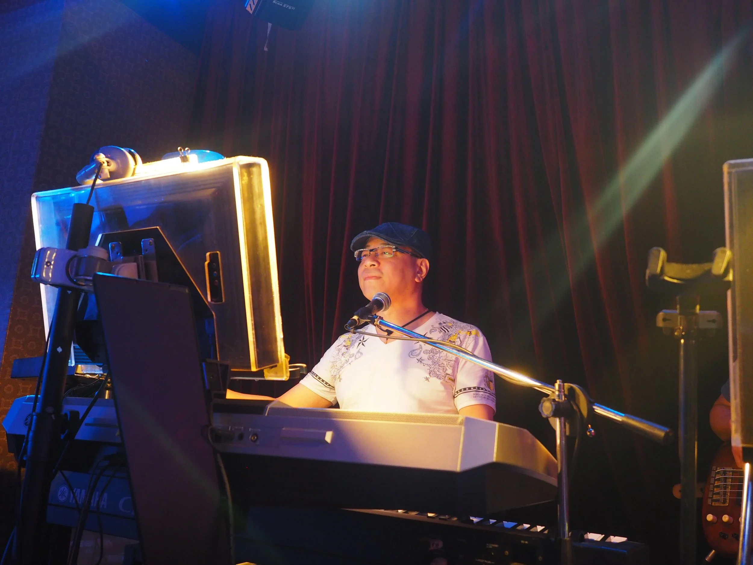 Vincent Liu, 2026 Arts & Music Grant recipient, performing at a keyboard and microphone.