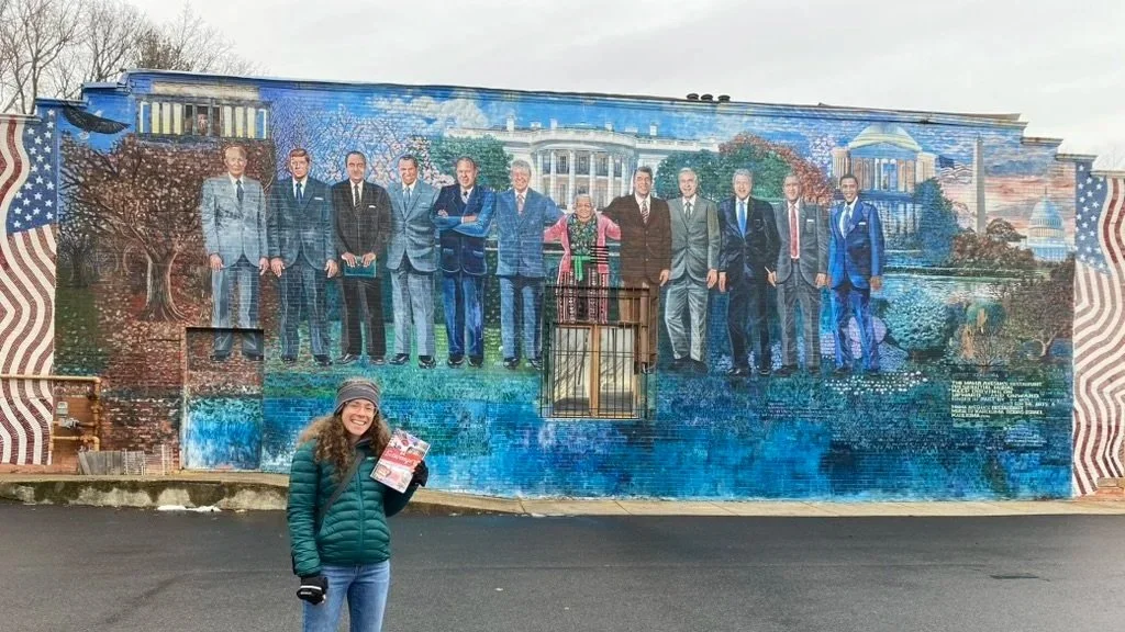 Woman holding the book DC Scavenger in Anacostia