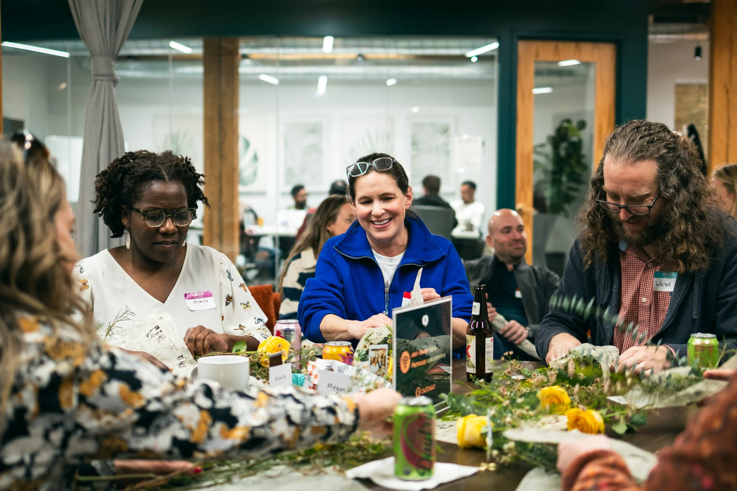 Workshop attendees work on their floral arrangements