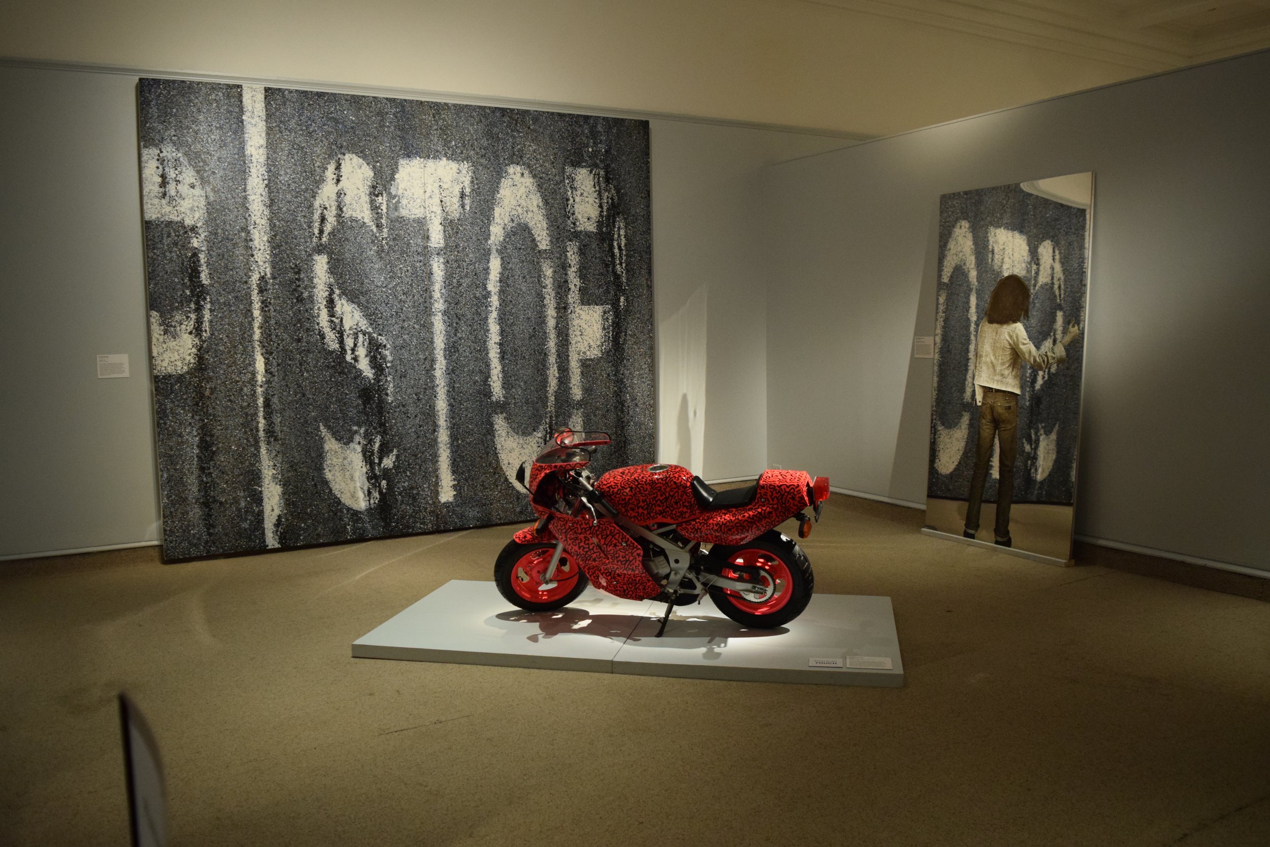  Richard Sigmund,  Stop  (1983); LA II,   Untitled (Pink Motorcycle)  (1991); Michaelangelo Pistoletto,  Gray Hitchhiker  (1962-79) 