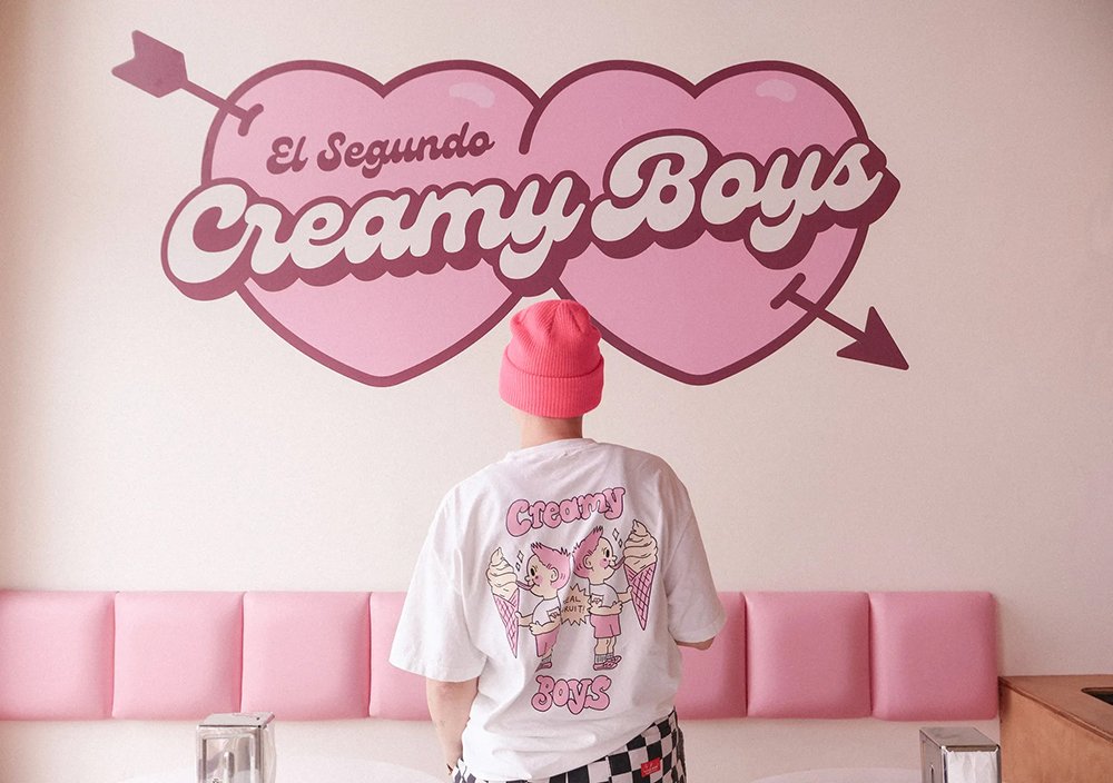 Customer in Creamy Boys El Segundo store wearing branded merchandise t-shirt