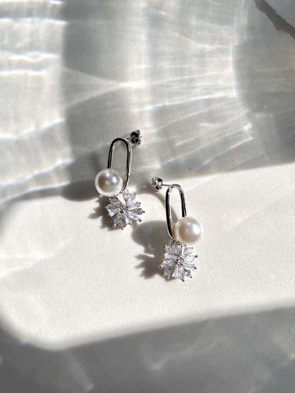 Modern White Gold Silver Pearl Earrings: Perfect for Brides. Gaia Earrings are made of flowers rhinestone and pearl for your wedding day