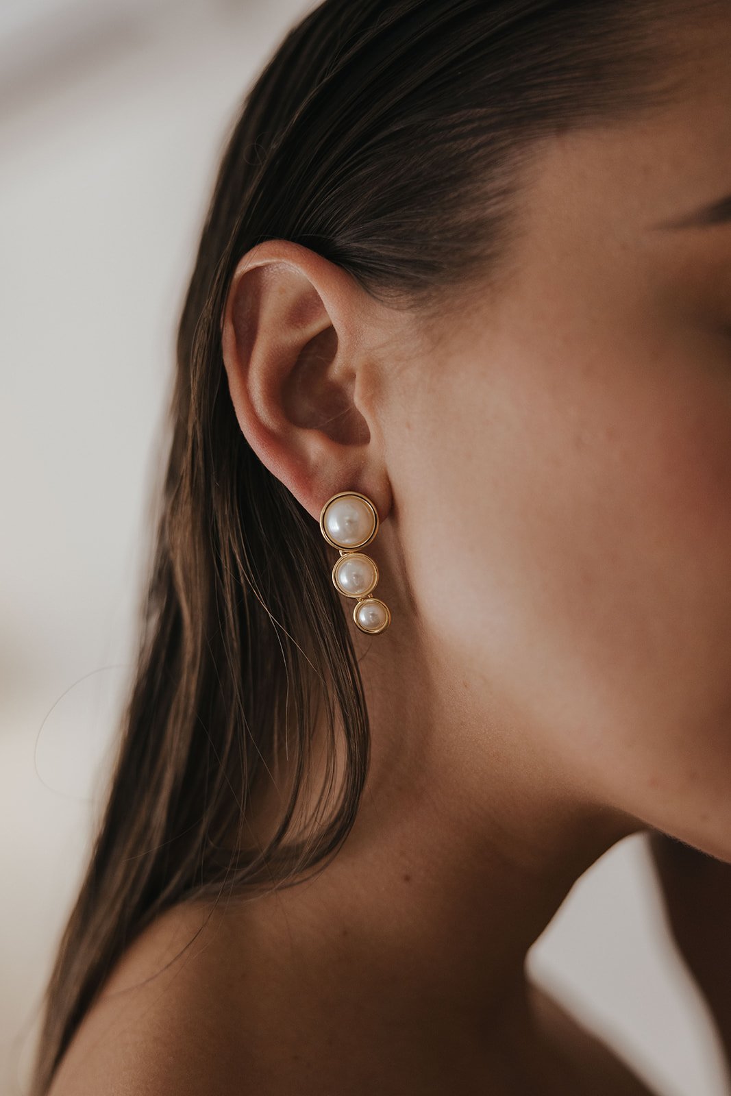 Vintage Inspired Modern Bridal Jewelry. 3 three pearls drop stacked gold wedding earrings.