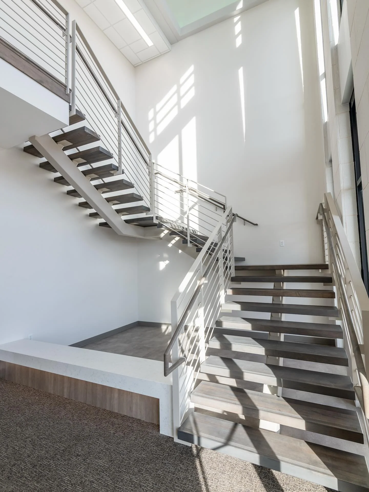 Starting out the year crisp and clean. 

Single stringer, bar railing, custom-stained. Both front and rear entrance staircases for this commercial customer, fully engineered and fabricated in-house. Why divide the details of a staircase to a handful 