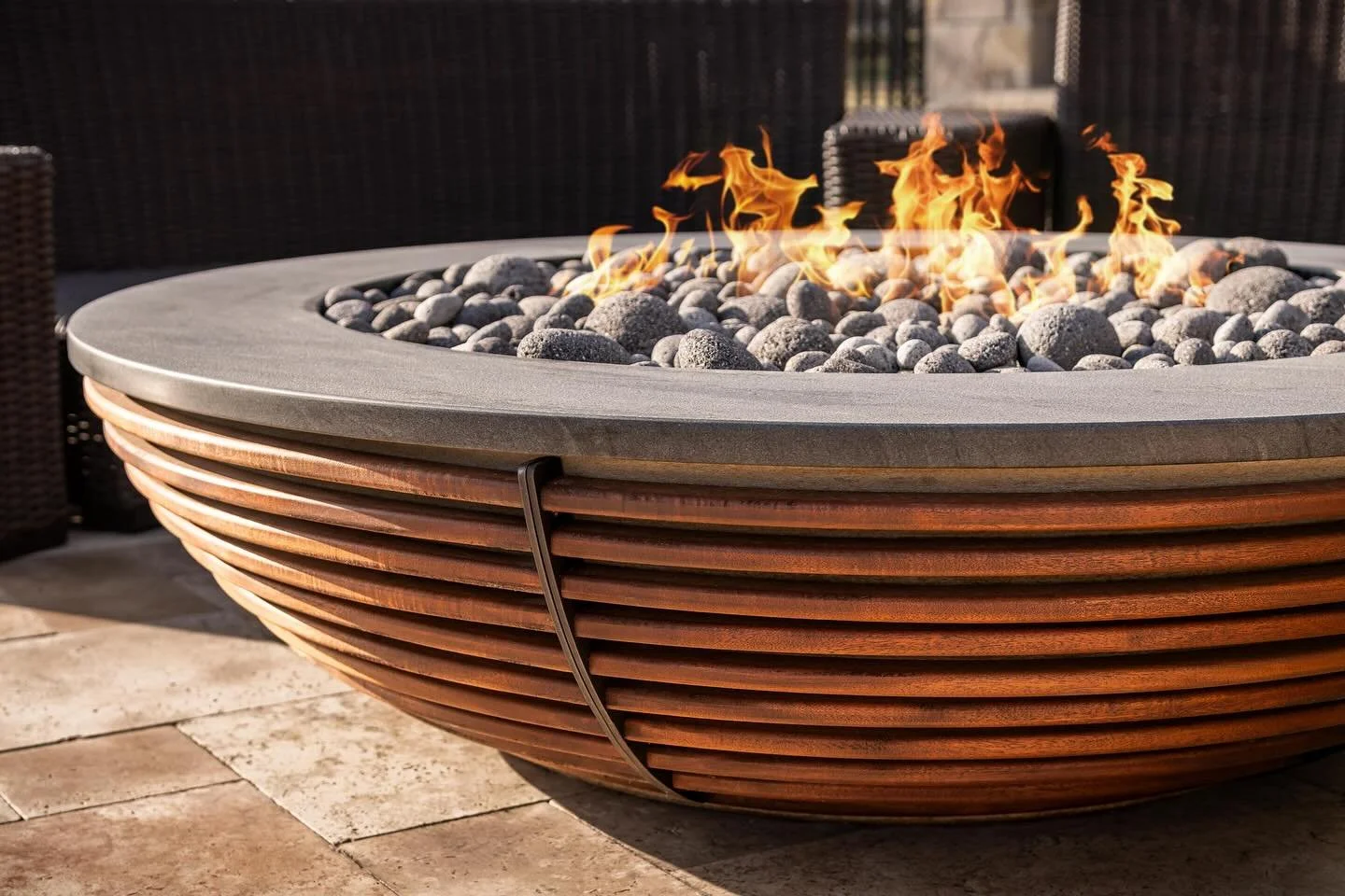Custom designed in-house and meticulously crafted, this concrete, mahogany, and granite fire bowl with piped-in natural gas line is a whopping 60&rdquo; diameter. Perfect for large evening gatherings in both beautiful and chilly weather!