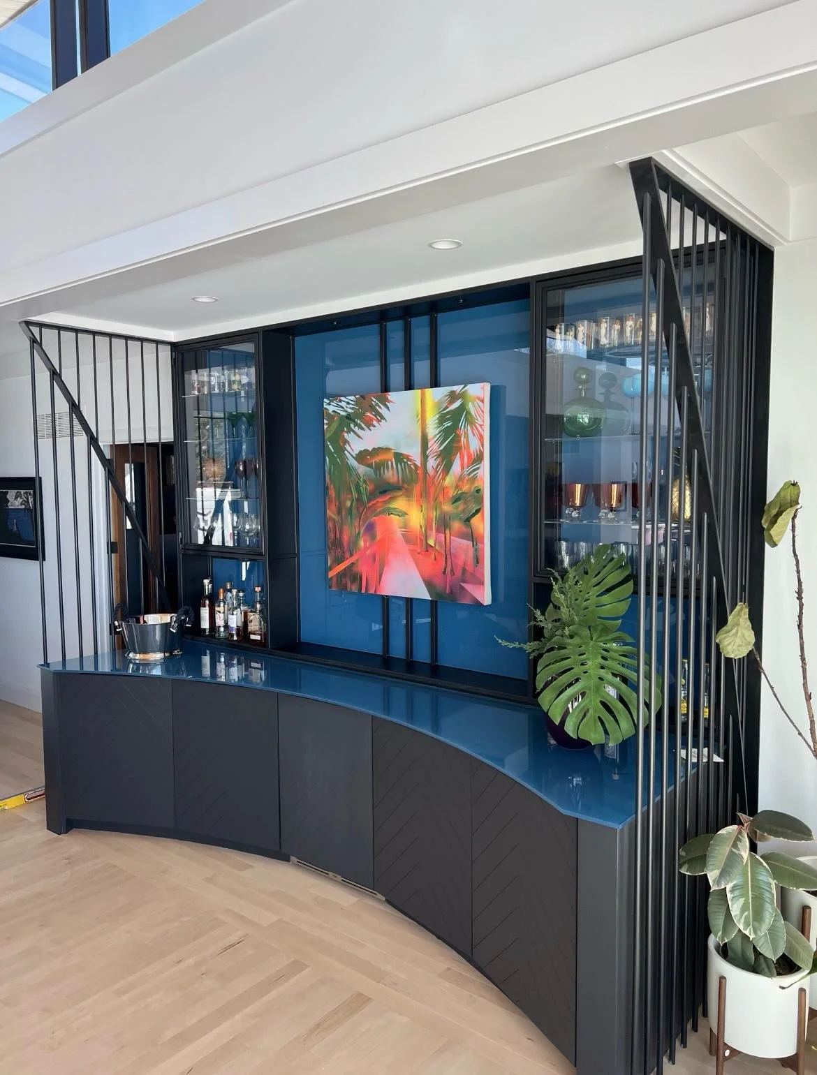 Entertaining your thing? Check out this custom dry bar. Metal screens and custom metal and glass upper class cabinets and art mounts reimagine what &ldquo;I&rsquo;ll grab you a glass&rdquo; can look like. 🤩