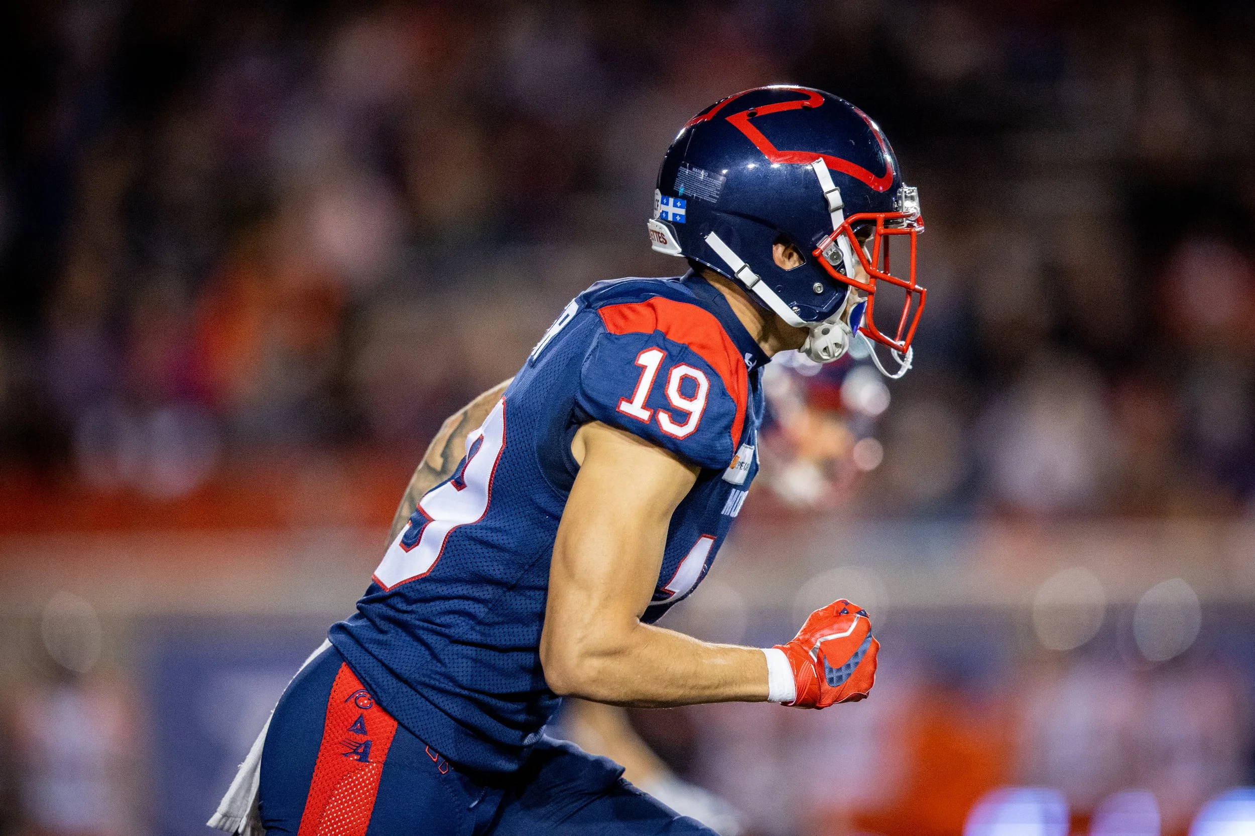 Next Up Nova coach Dante Absher playing football