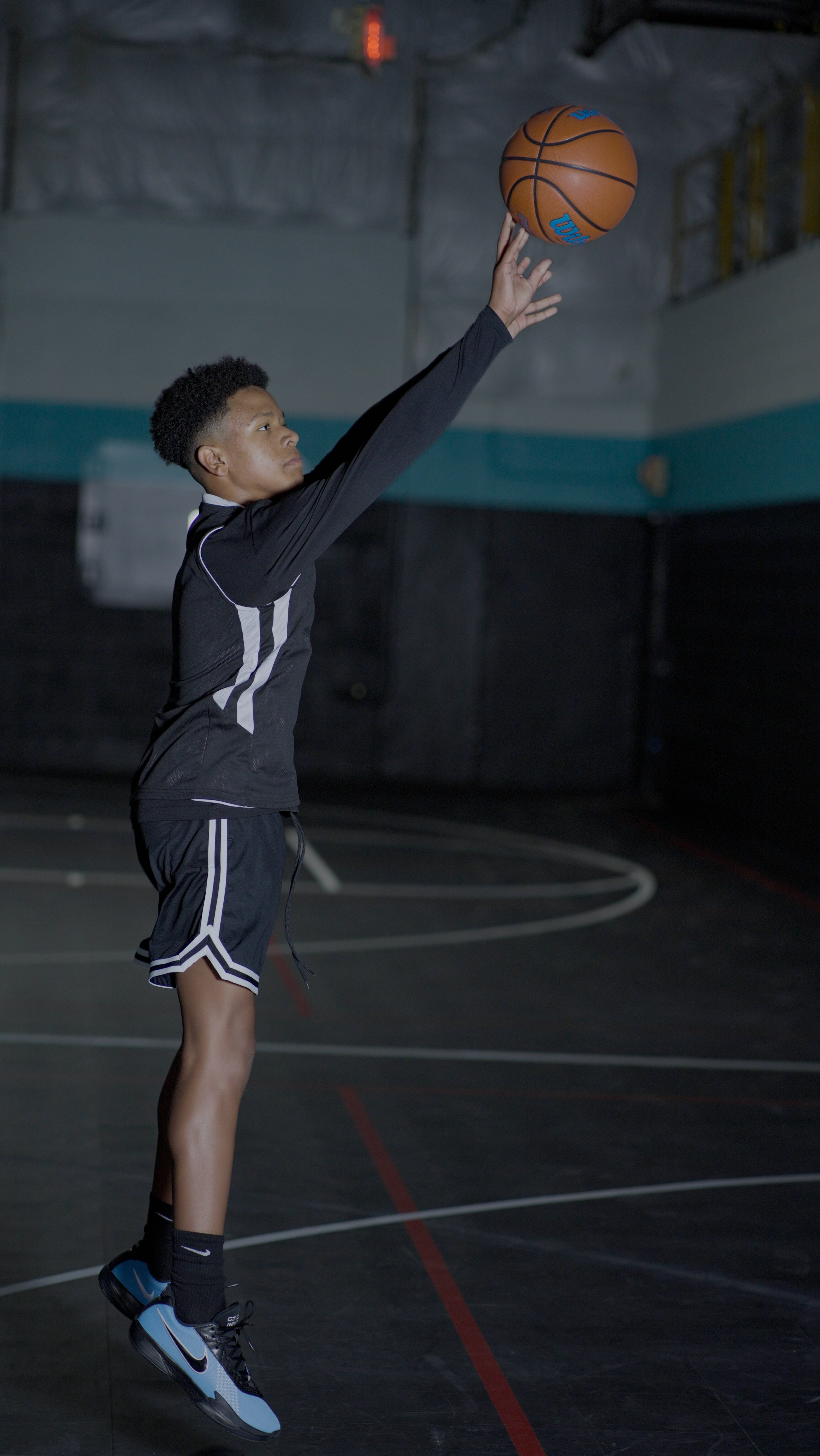 boy shooting basketball showcasing next up nova basketball training