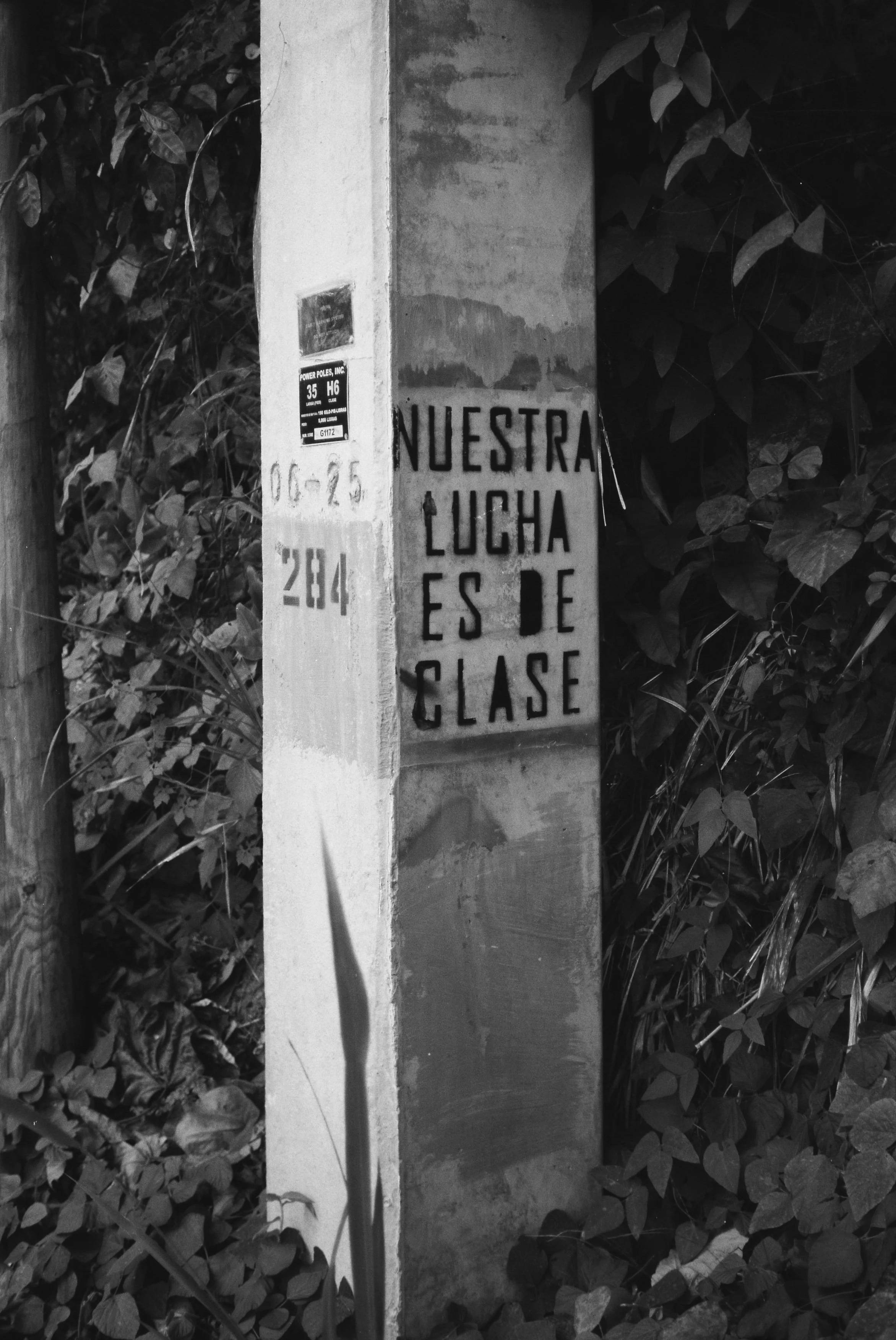 Painted by a community member on the cement light poles are messages like this one. Nearly the entire drive into town. Warranted critiques of colonialism and class are regular conversation in our neighborhood.